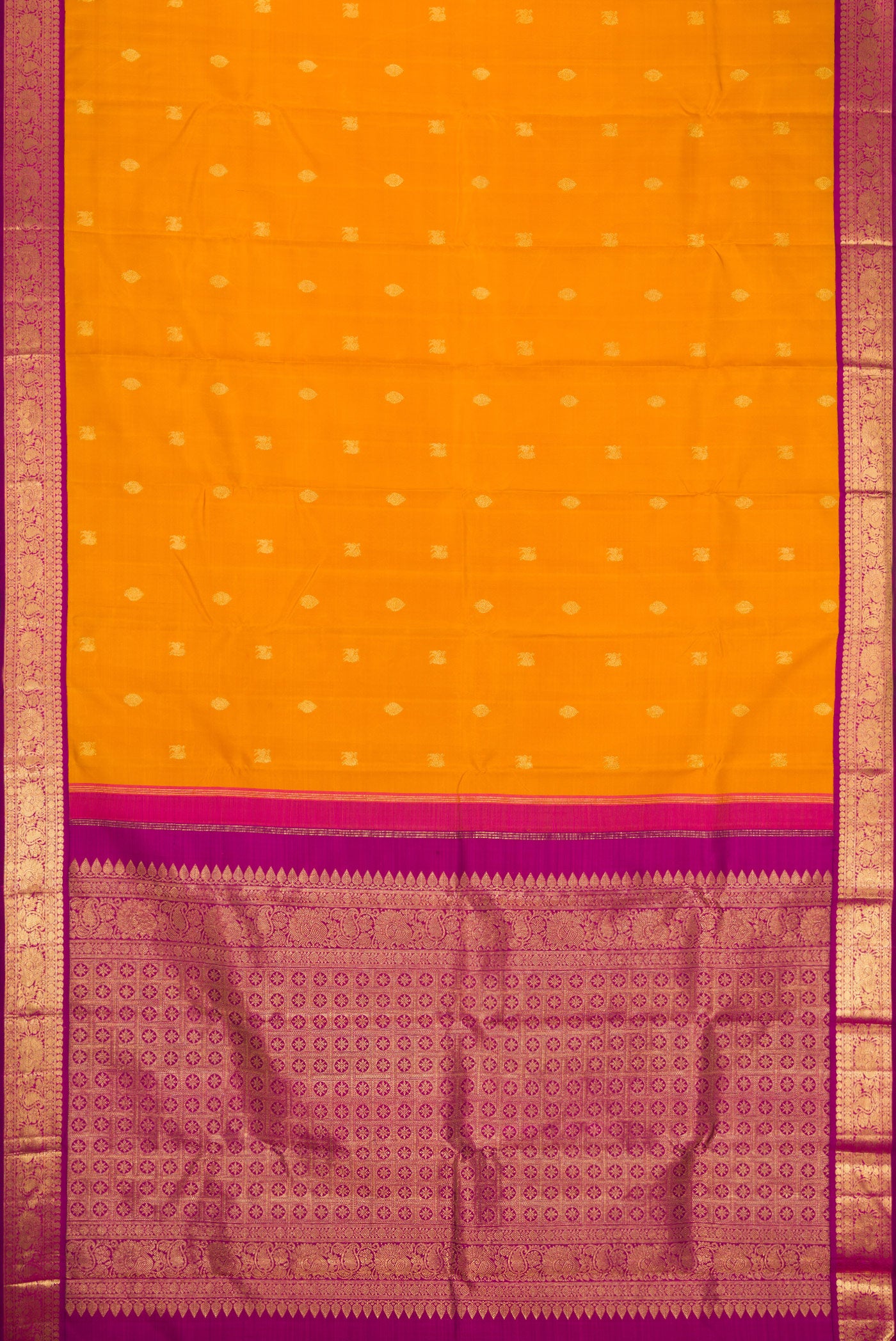 Flat view of Mustard Dual Tone Kanjivaram Silk Saree with Zari Butta on the body and Zari Border. 