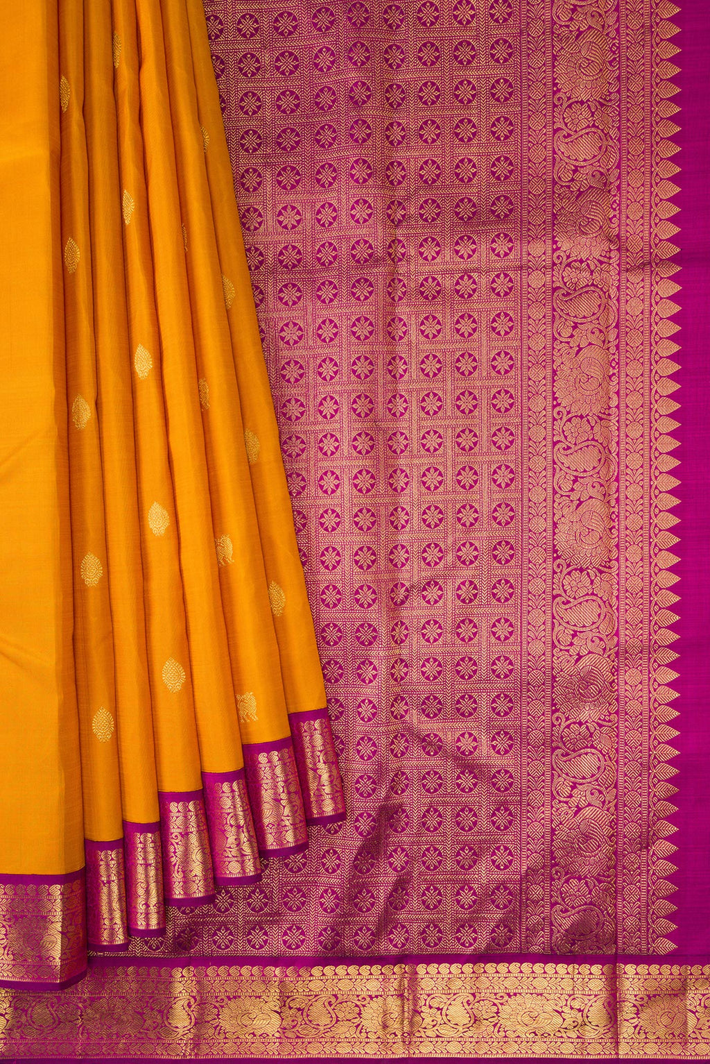 Pleats and pallu of Mustard Dual Tone Kanjivaram Silk Saree with Zari Butta on the body and Zari Border. 