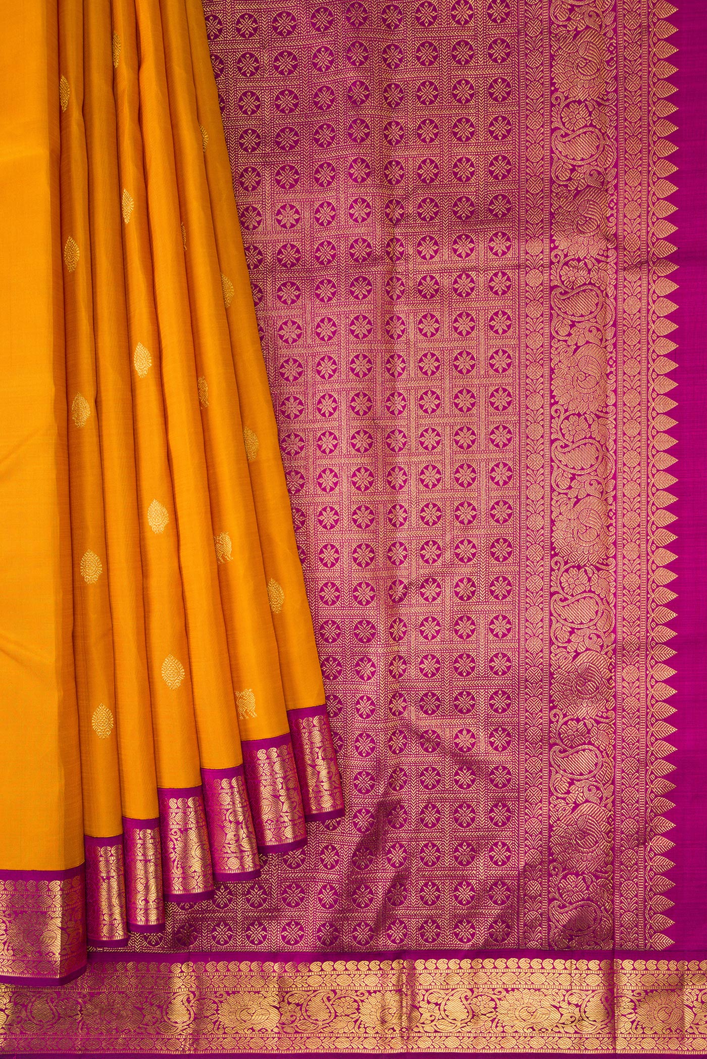 Pleats and pallu of Mustard Dual Tone Kanjivaram Silk Saree with Zari Butta on the body and Zari Border. 