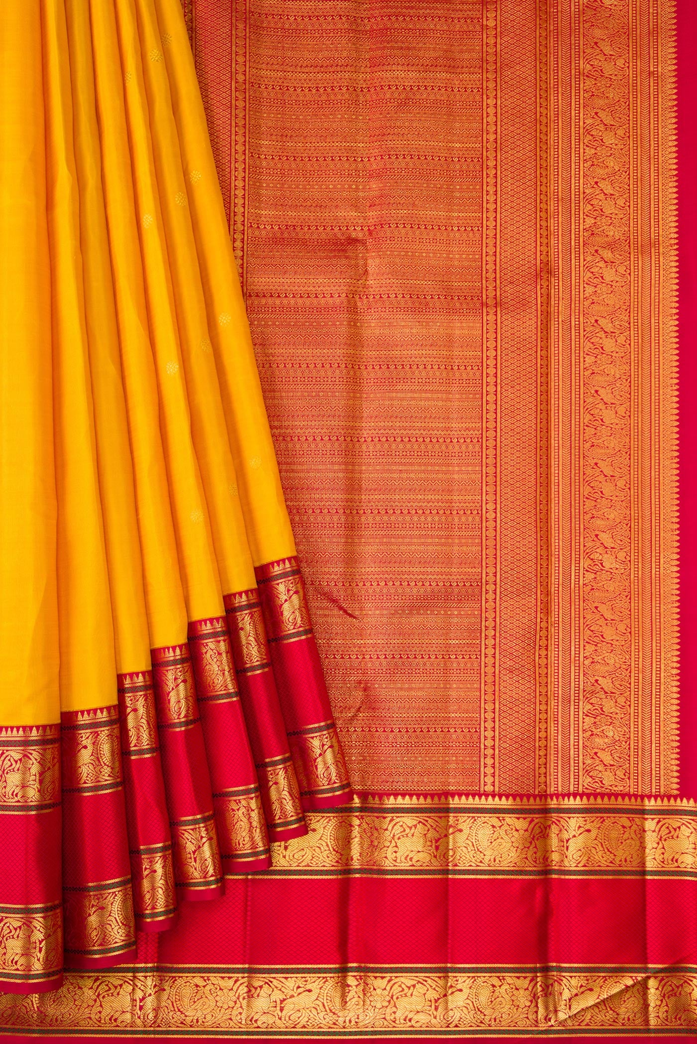 Pleats and pallu of Yellow Dual Tone Kanchipuram Silk Saree with Zari Butta on the body and Zari Border. 