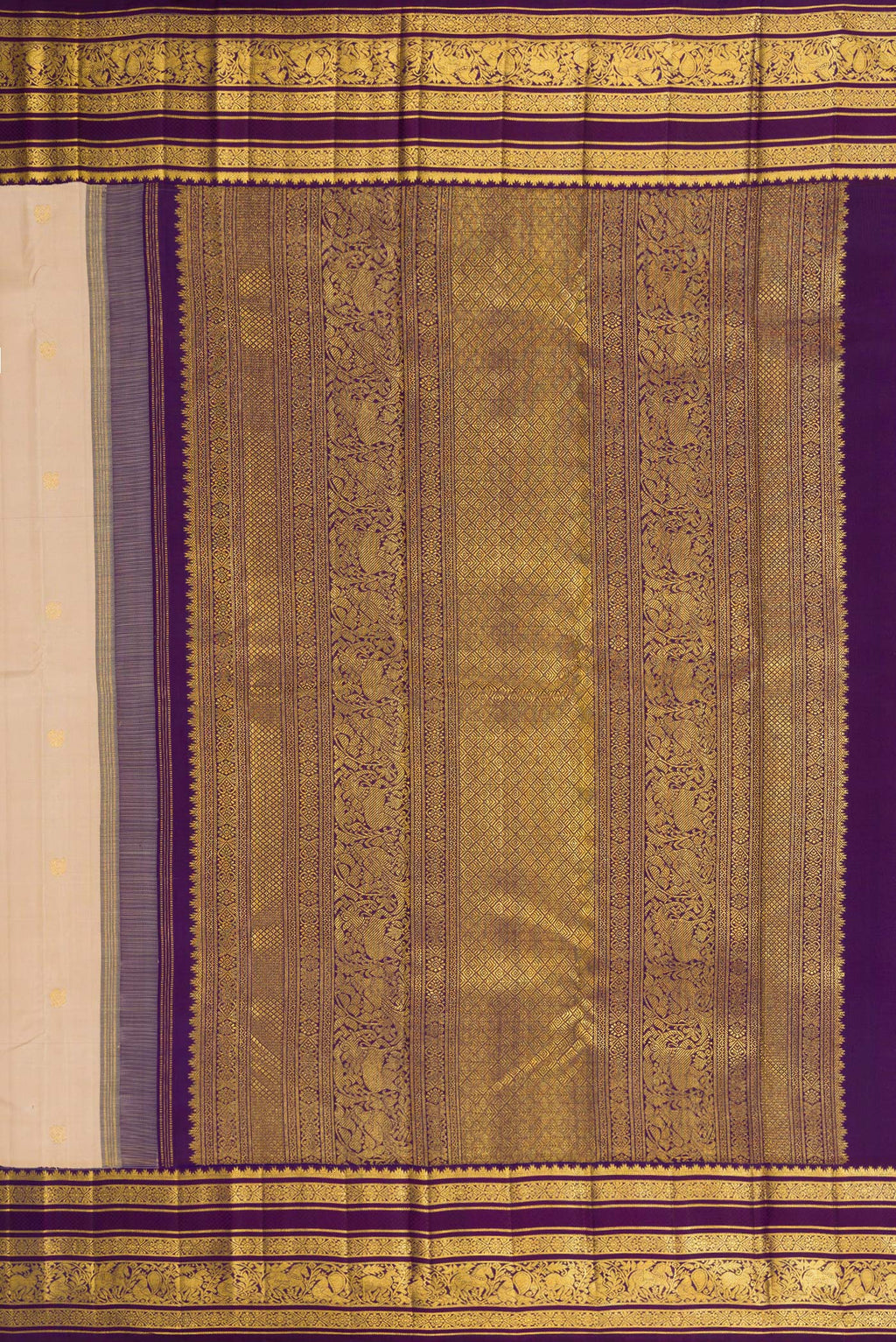 Close up image of the pallu of Beige Dual Tone Kanchipuram Silk Saree with Zari Butta on the body and Zari Border. 