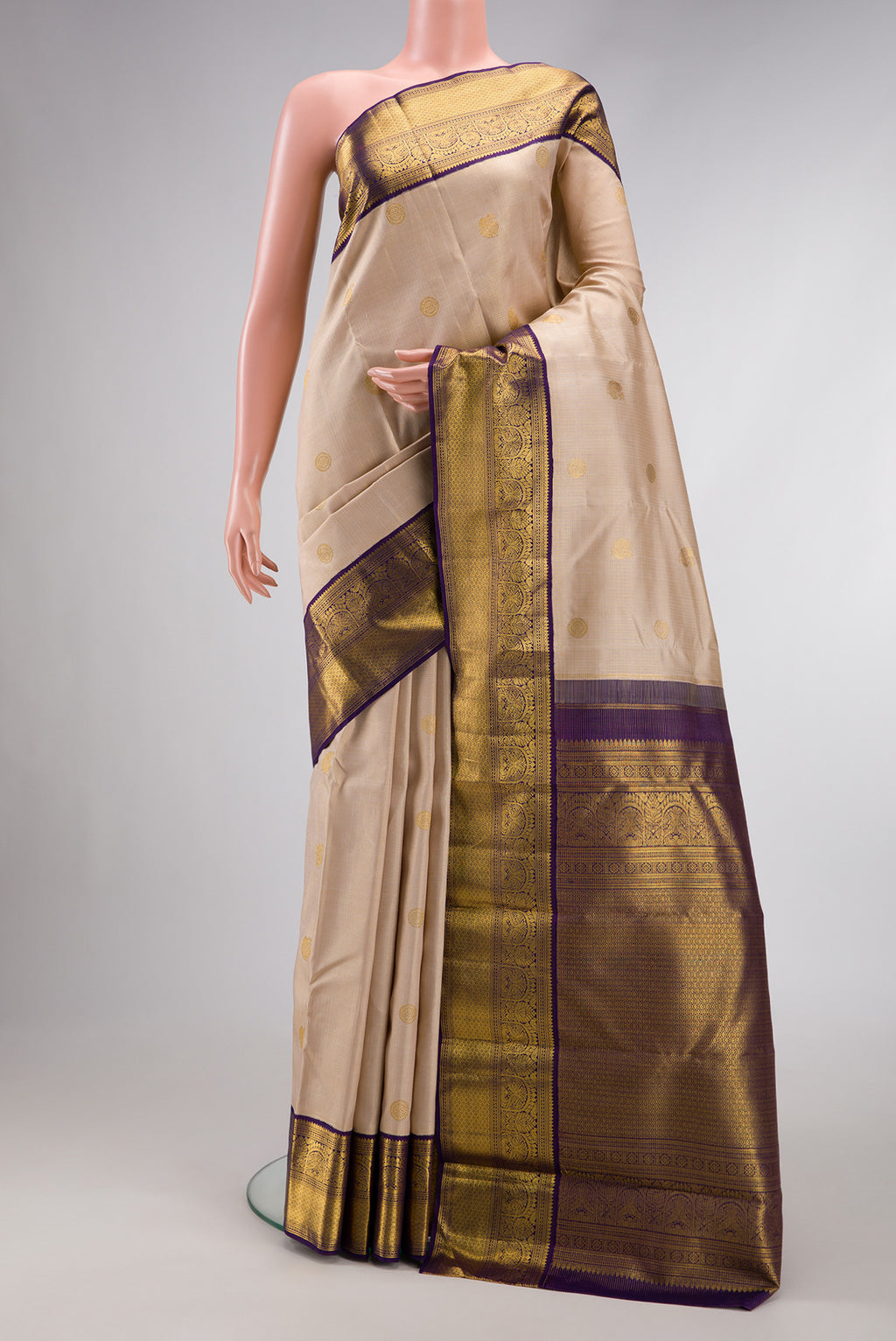 Dark Beige Dual Tone Kanchipuram Silk Saree with Zari Butta on the body and Zari Border.  displayed on a mannequin