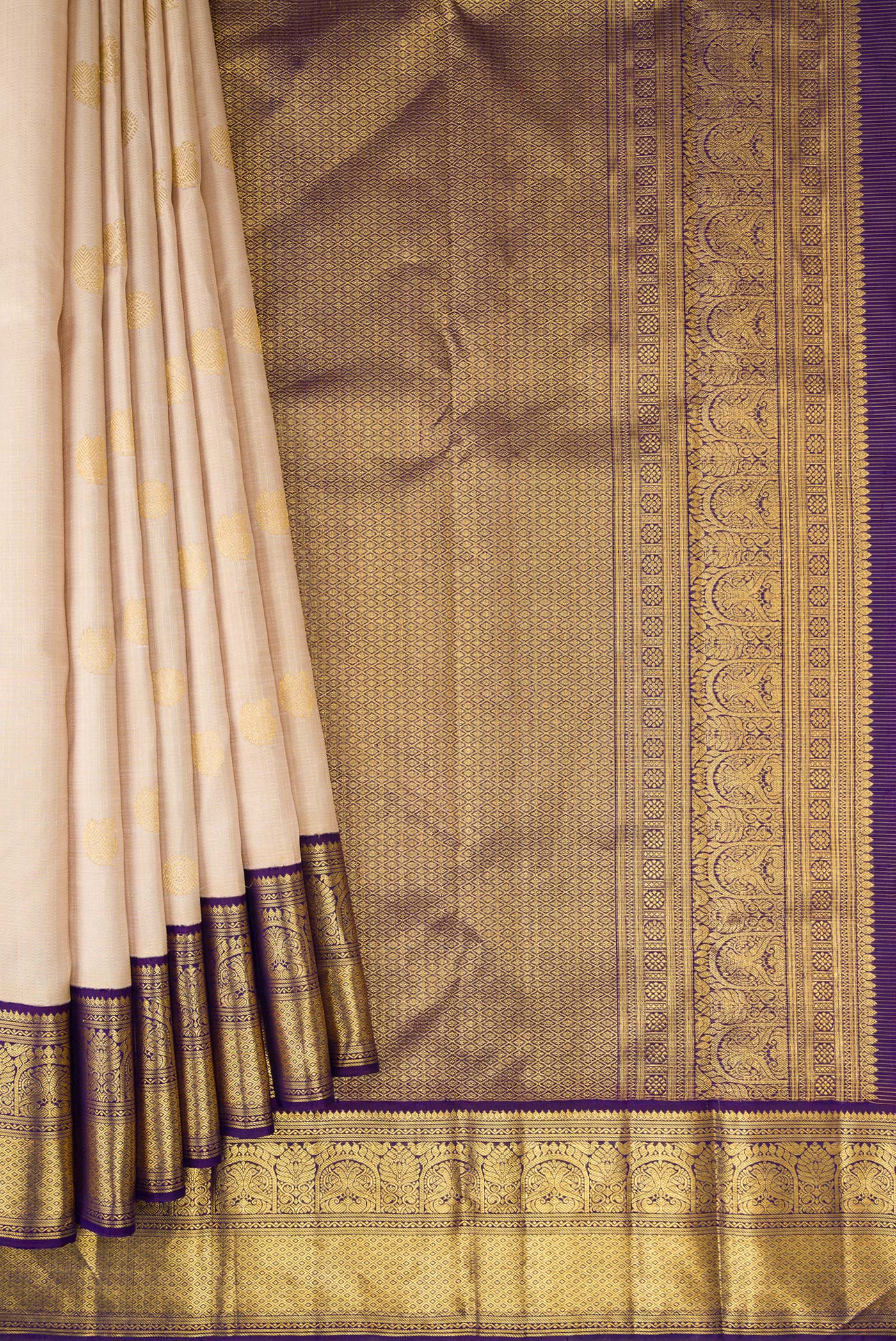 Pleats and pallu of Dark Beige Dual Tone Kanchipuram Silk Saree with Zari Butta on the body and Zari Border. 