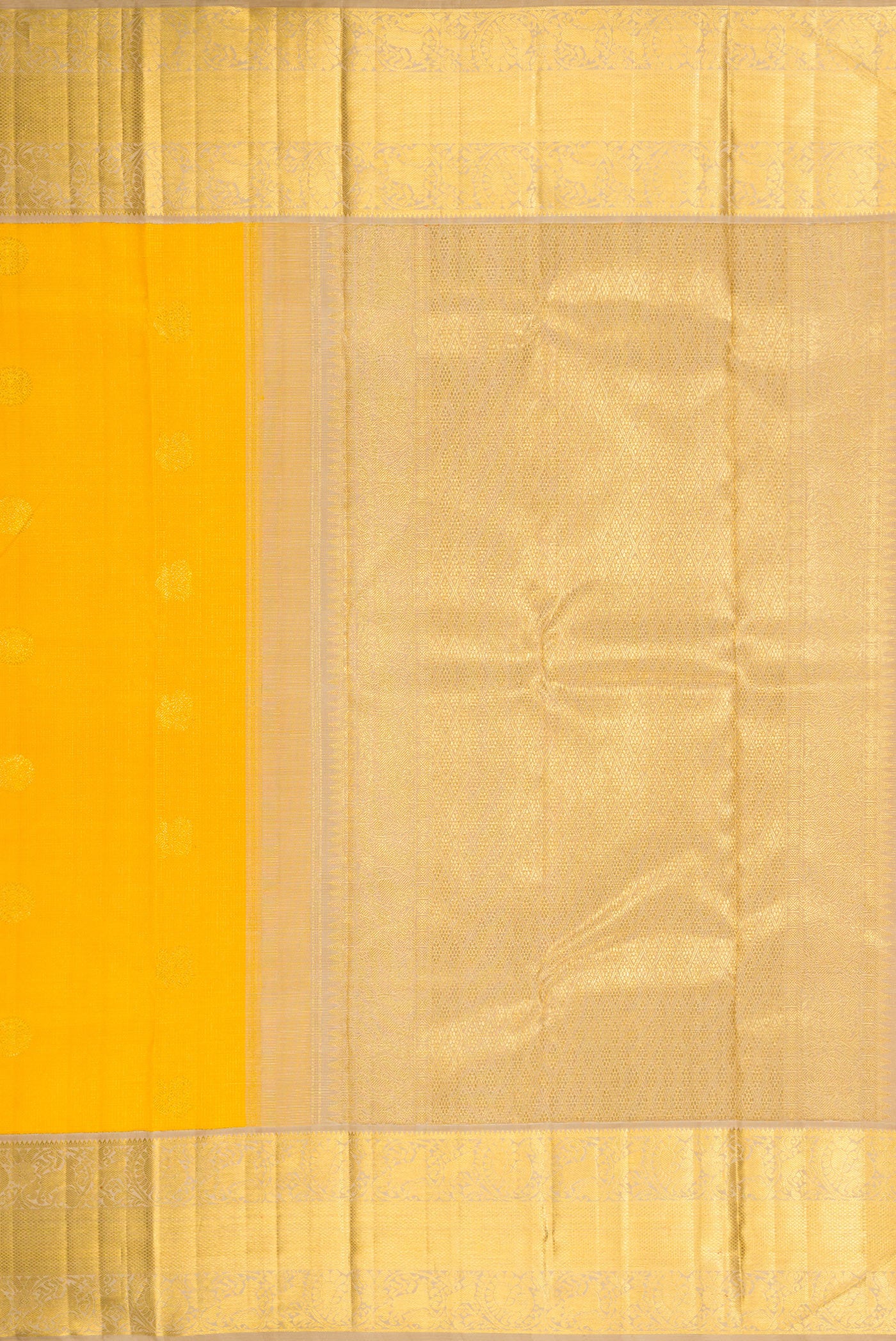 Close up image of the pallu of Yellow Dual Tone Kanchipuram Silk Saree with Zari Butta on the body and Zari Border. 