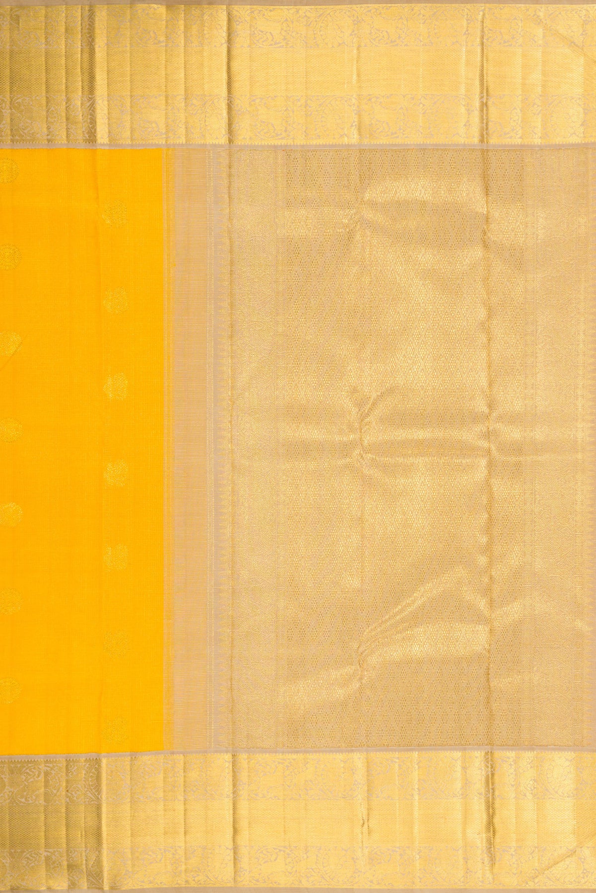 Close up image of the pallu of Yellow Dual Tone Kanchipuram Silk Saree with Zari Butta on the body and Zari Border. 