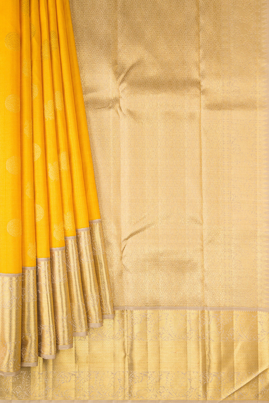 Pleats and pallu of Yellow Dual Tone Kanchipuram Silk Saree with Zari Butta on the body and Zari Border. 