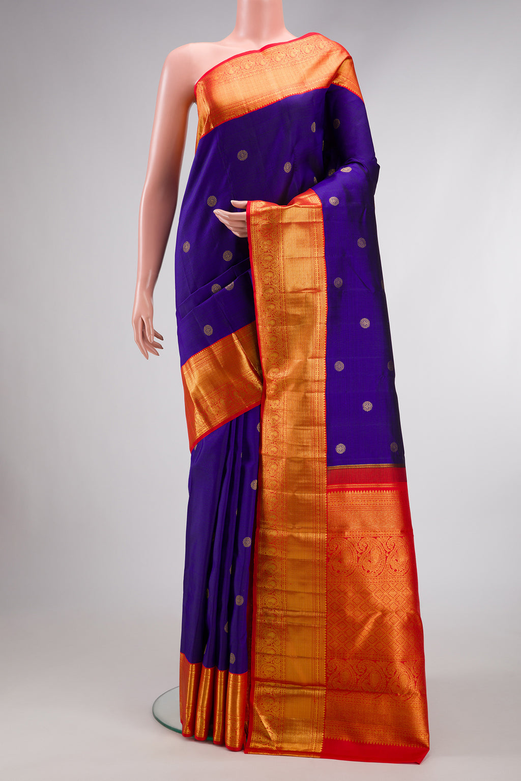 Royal Blue Dual Tone Kanchipuram Silk Saree with Zari Butta on the body and Zari Border.  displayed on a mannequin