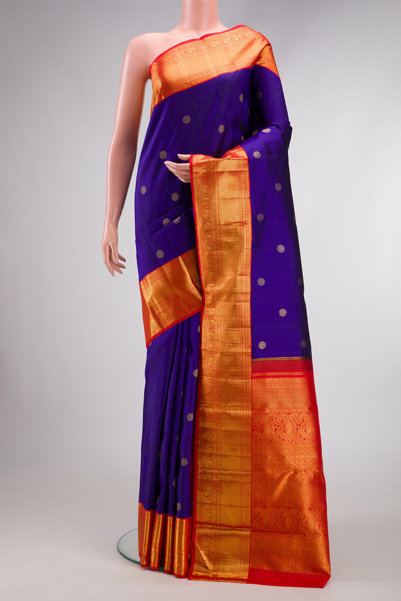 Royal Blue Dual Tone Kanchipuram Silk Saree with Zari Butta on the body and Zari Border.  displayed on a mannequin