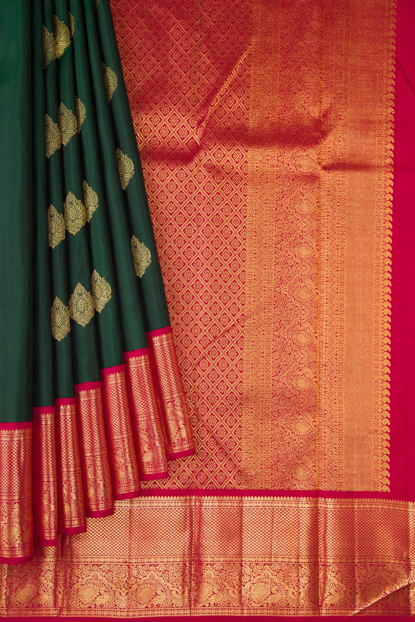 Pleats and pallu of Green Dual Tone Kanchipuram Silk Saree with Zari Butta on the body and Zari Border. 