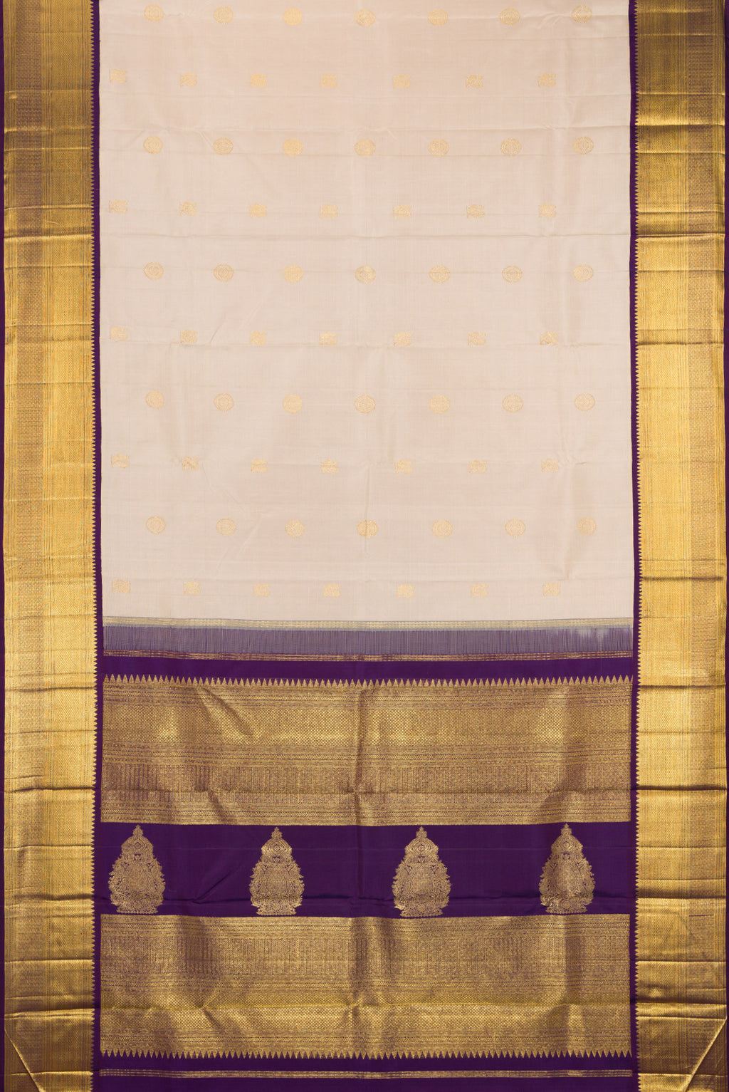 Flat view of Beige Kanchipuram Silk Saree with Zari Butta on the body and Zari Border. 