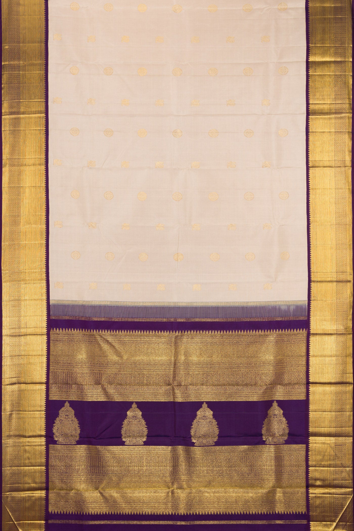Flat view of Beige Kanchipuram Silk Saree with Zari Butta on the body and Zari Border. 
