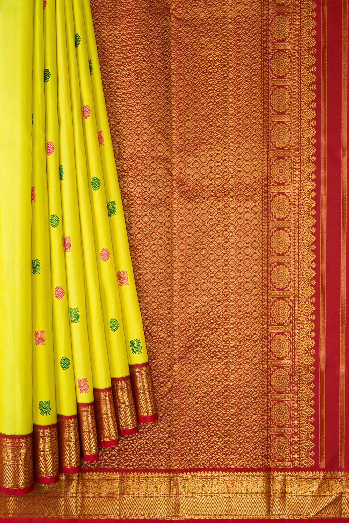 Pleats and pallu of Pure Silk Pure Zari Lemon Yellow Dual Tone Kanjivaram Saree with Thread Butta on the body and Ganga Jamuna Border. 