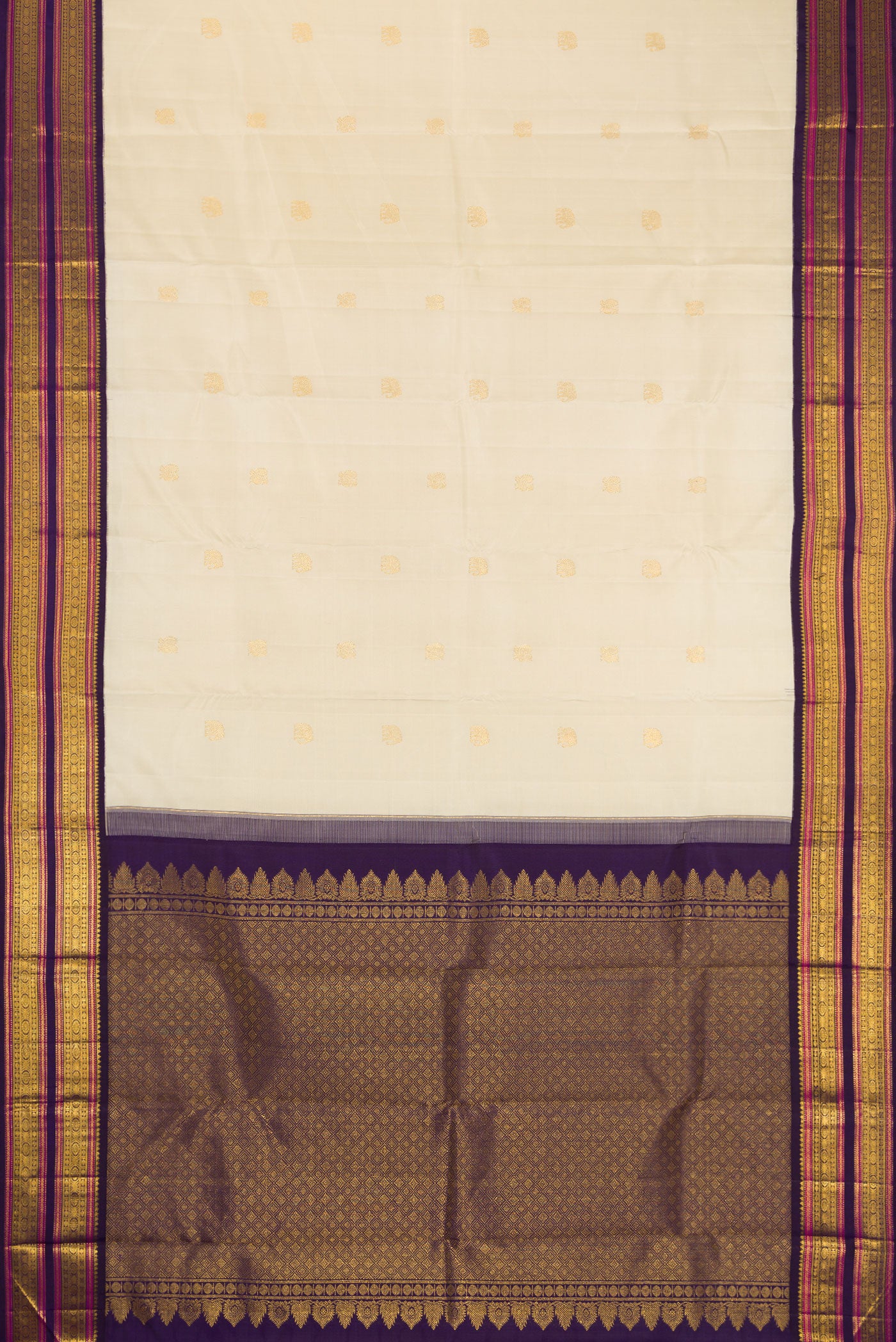Flat view of Pure Silk Pure Zari Off White Dual Tone Kanjivaram Saree with Zari Butta on the body and Zari Border. 