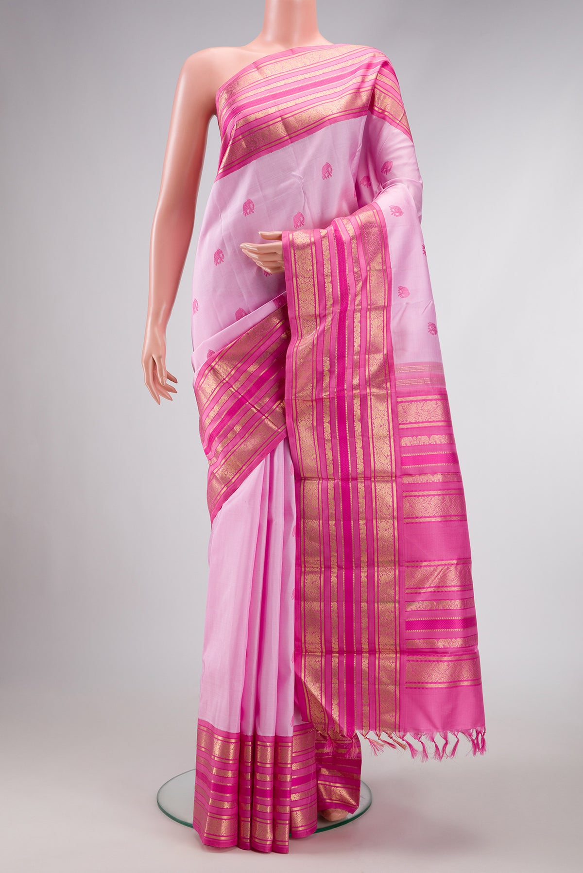 Pure Silk Pure Zari Rose pink Dual Tone Kanchipuram Saree with Thread Butta on the body and Fancy Border.  displayed on a mannequin