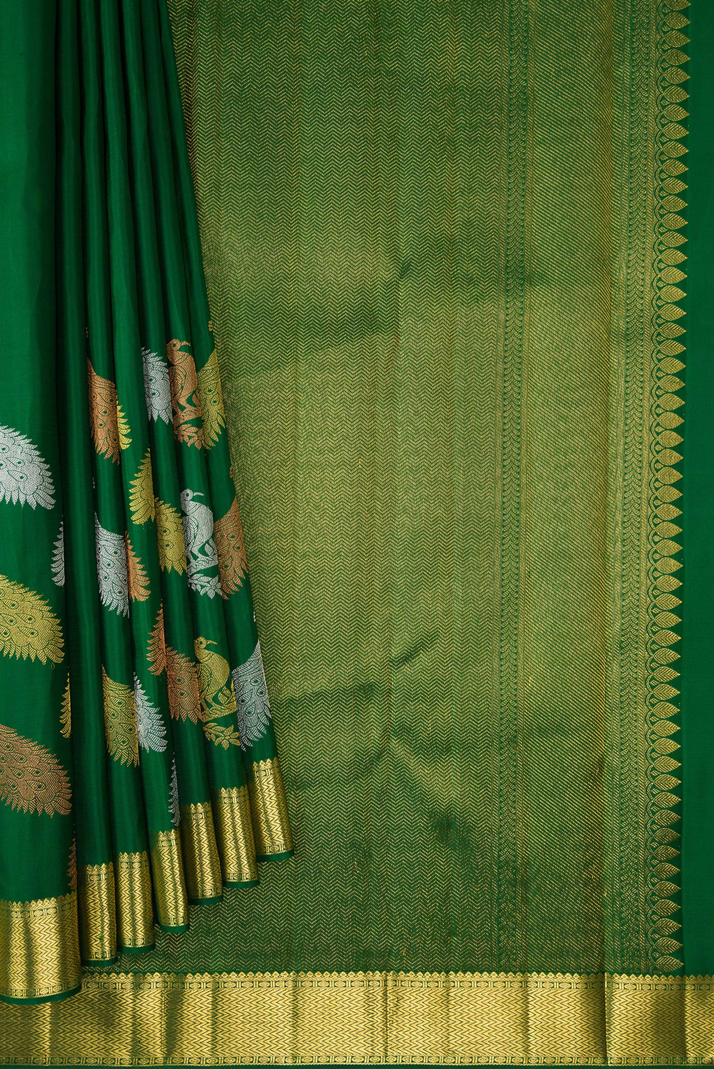 Pleats and pallu of Pure Silk Pure Zari Green Dual Tone Kanjivaram Saree with Plain Body and Fancy Border. 