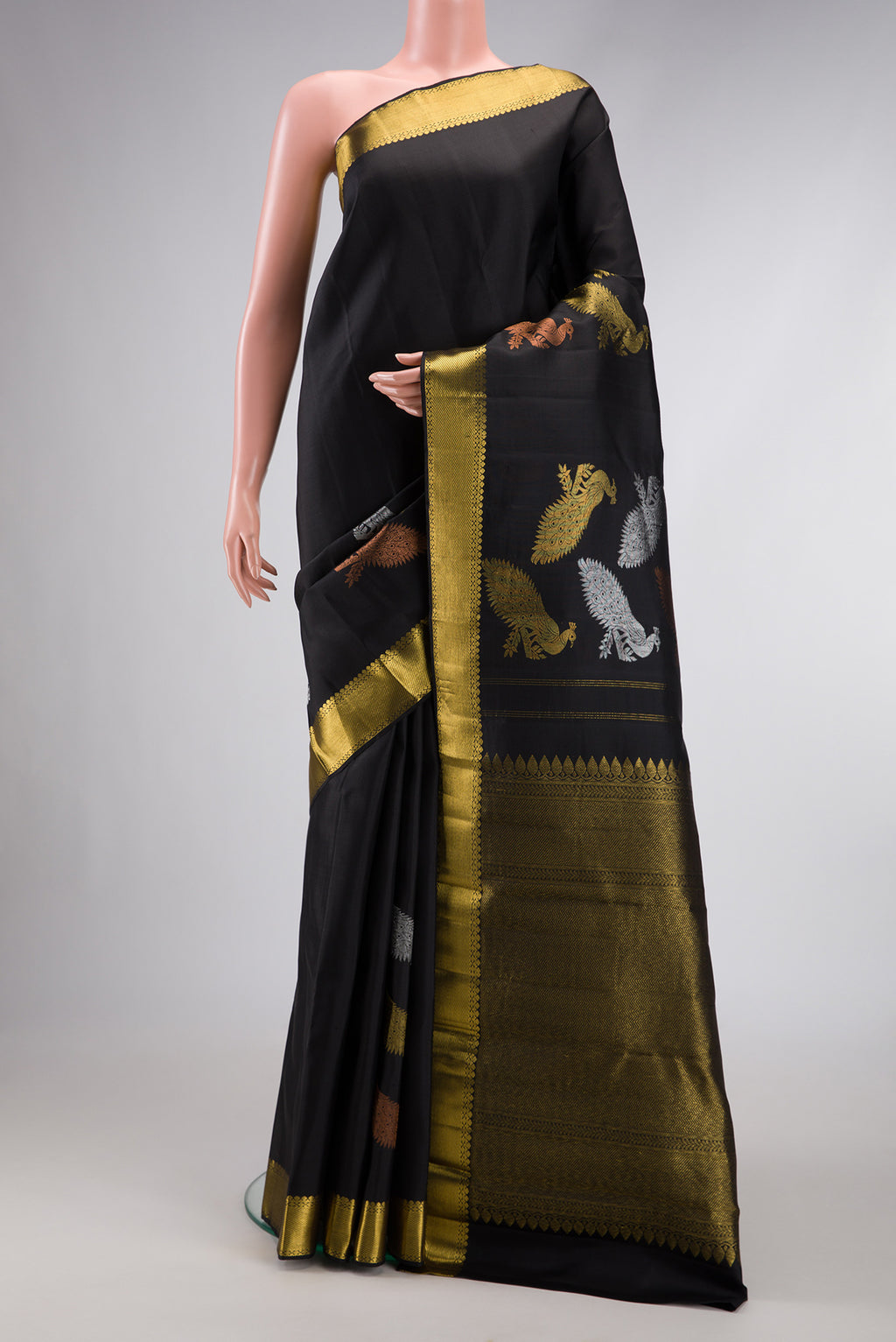 Black Dual Tone Kanjivaram Silk Saree with Plain Body and Fancy Border.  displayed on a mannequin