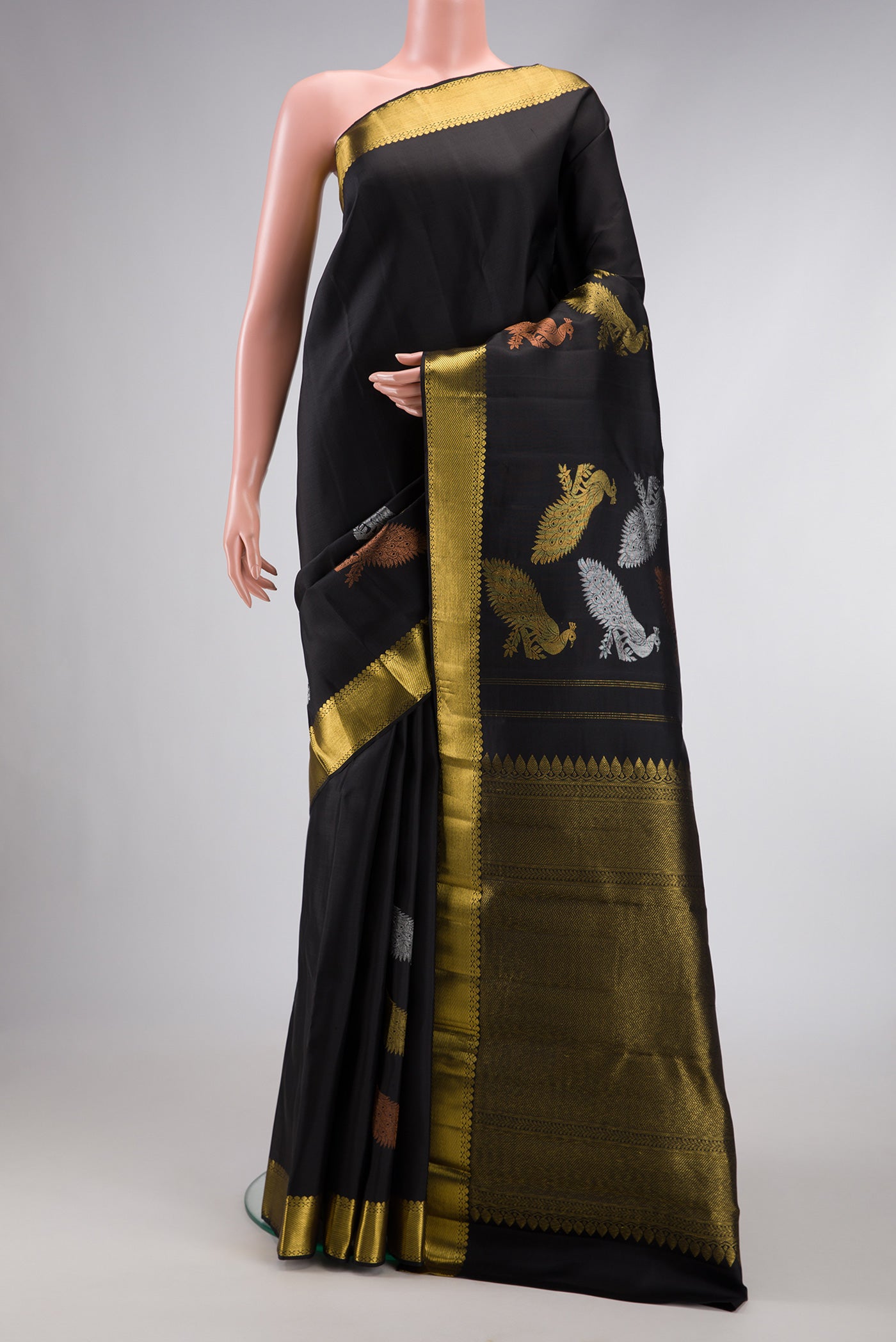 Black Dual Tone Kanjivaram Silk Saree with Plain Body and Fancy Border.  displayed on a mannequin