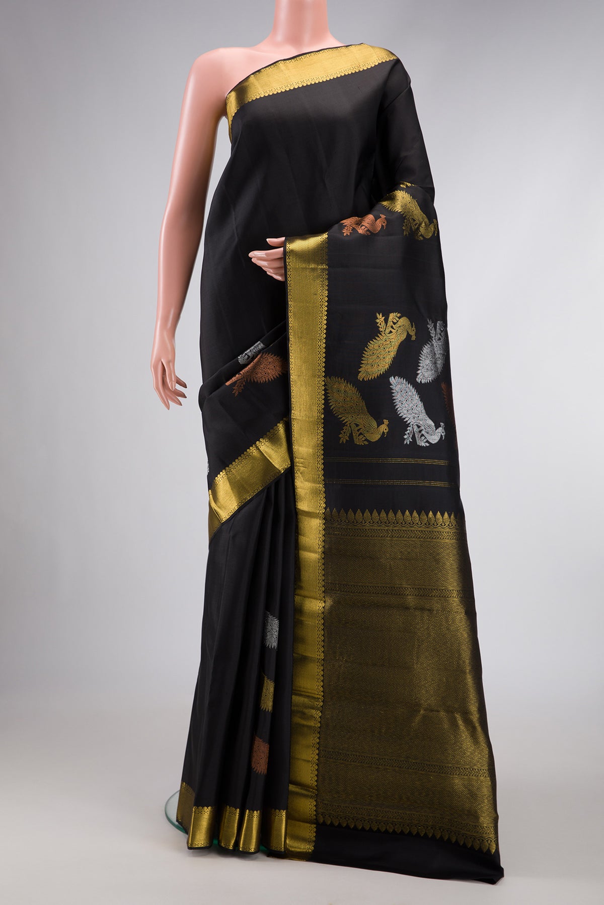 Black Dual Tone Kanjivaram Silk Saree with Plain Body and Fancy Border.  displayed on a mannequin