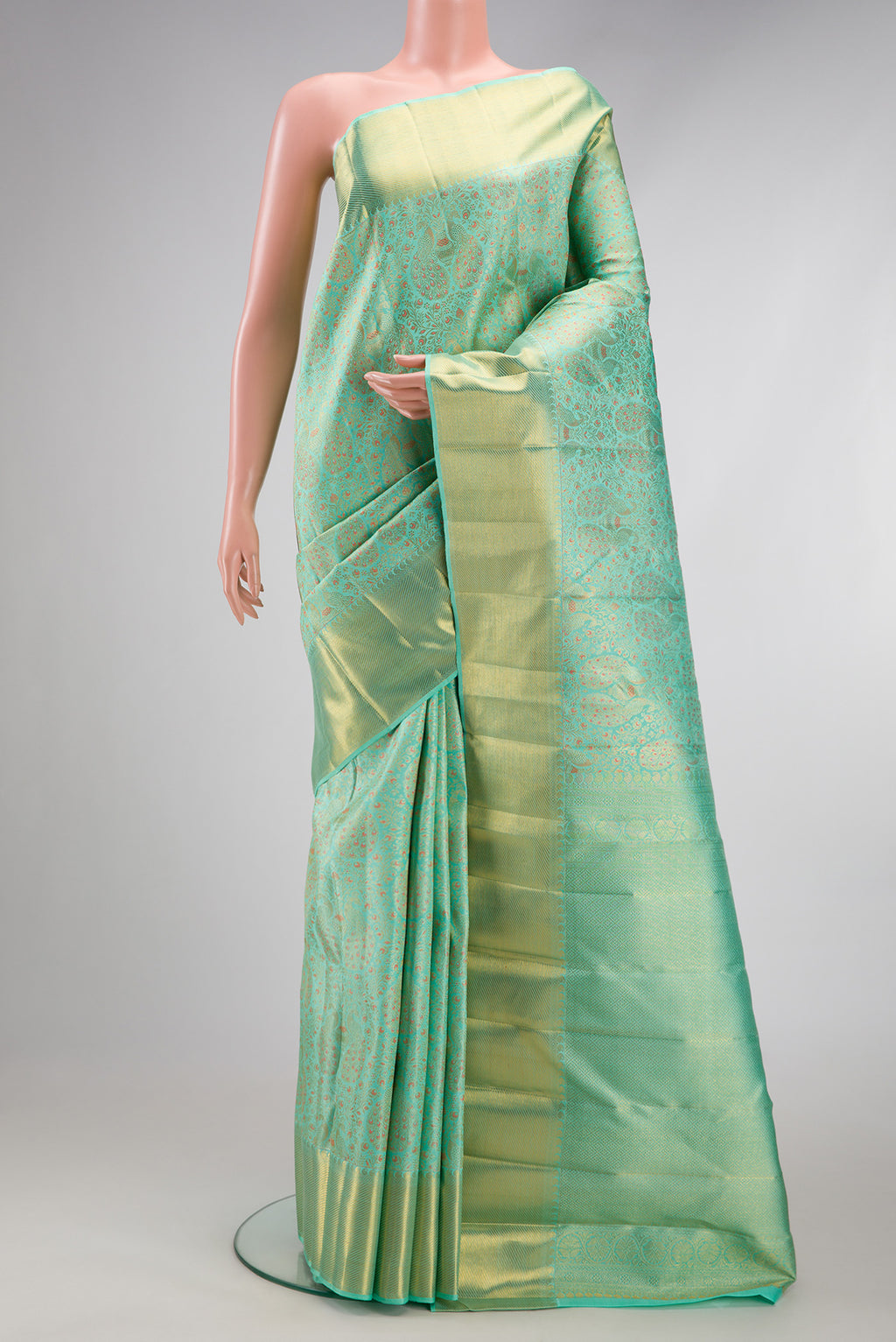 Pure Silk Pure Zari Sea Green Dual Tone Kanjivaram Saree with Zari Brocade on the body and Zari Border.  displayed on a mannequin
