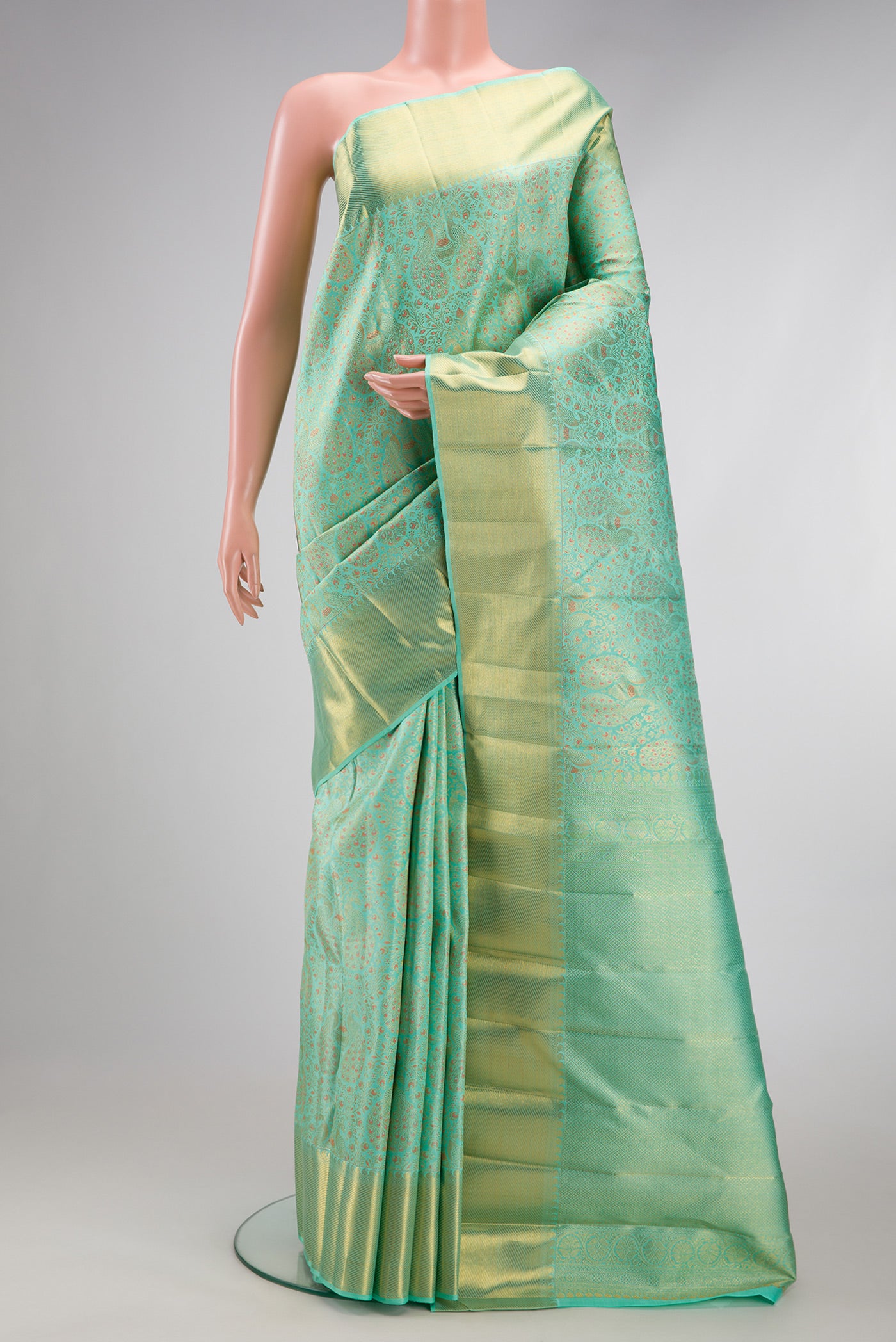 Pure Silk Pure Zari Sea Green Dual Tone Kanjivaram Saree with Zari Brocade on the body and Zari Border.  displayed on a mannequin