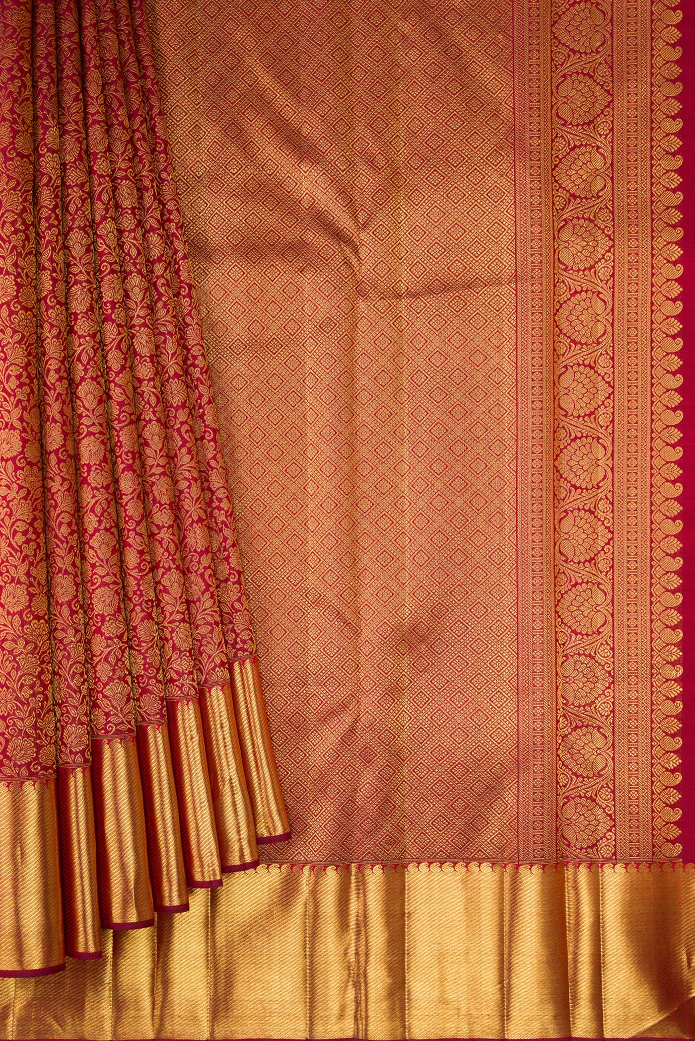 Pleats and pallu of Pure Silk Pure Zari Maroon Kanjivaram Saree with Zari Brocade on the body and Zari Border. 