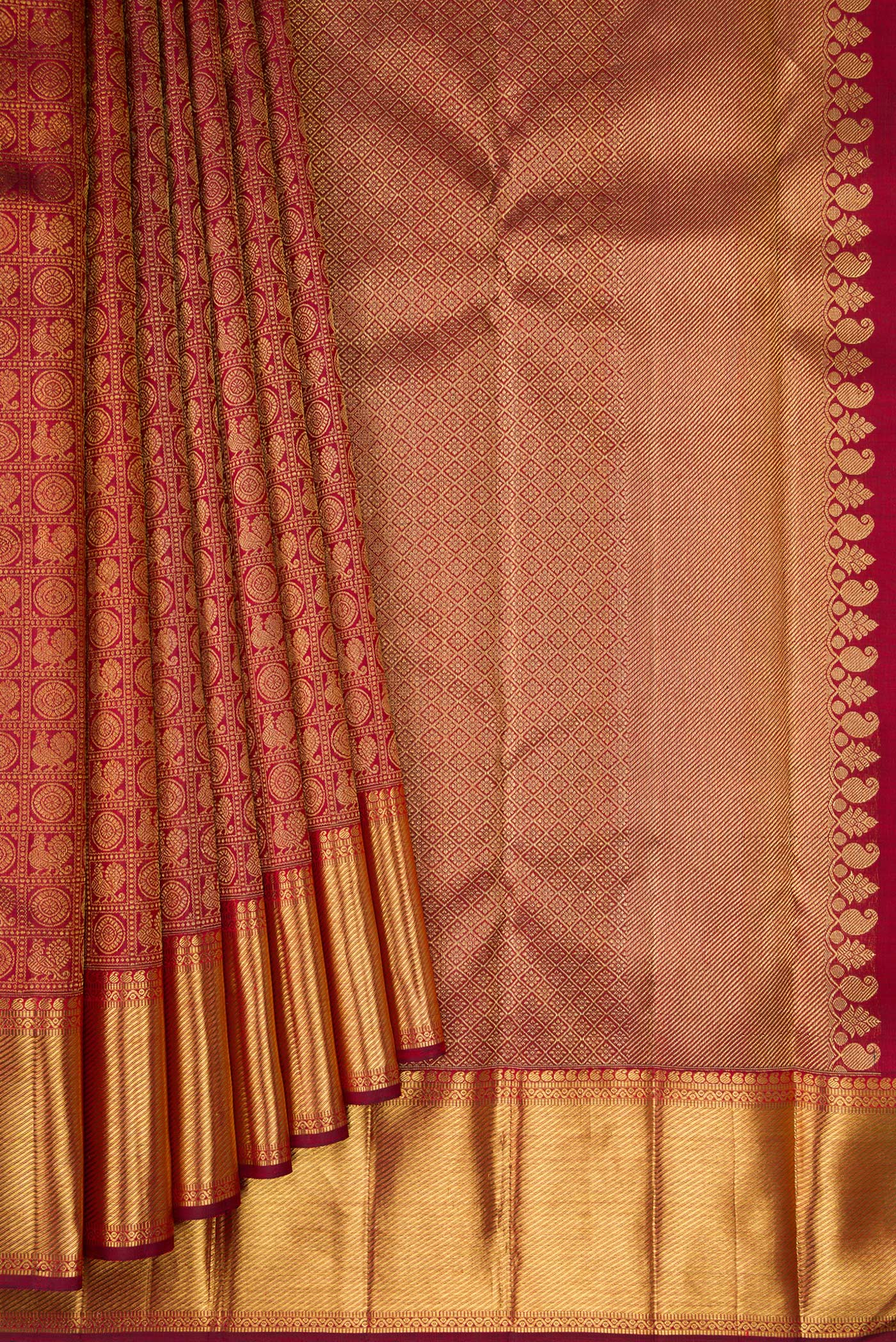 Pleats and pallu of Pure Silk Pure Zari Maroon Kanjivaram Saree with Zari Brocade on the body and Zari Border. 