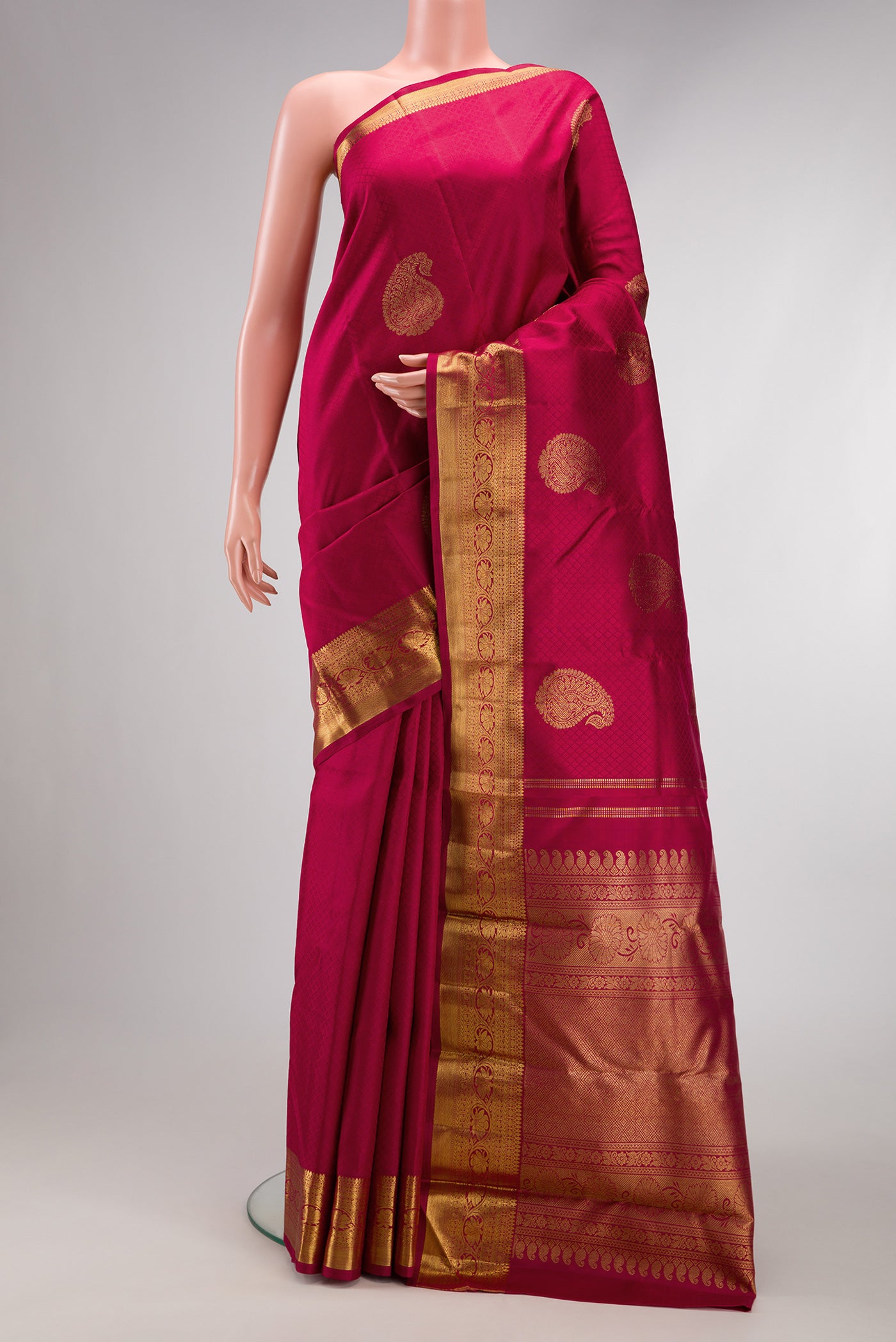 Pure Silk Pure Zari Maroon Dual Tone Kanjivaram Saree with Zari Butta on the body and Zari Border.  displayed on a mannequin