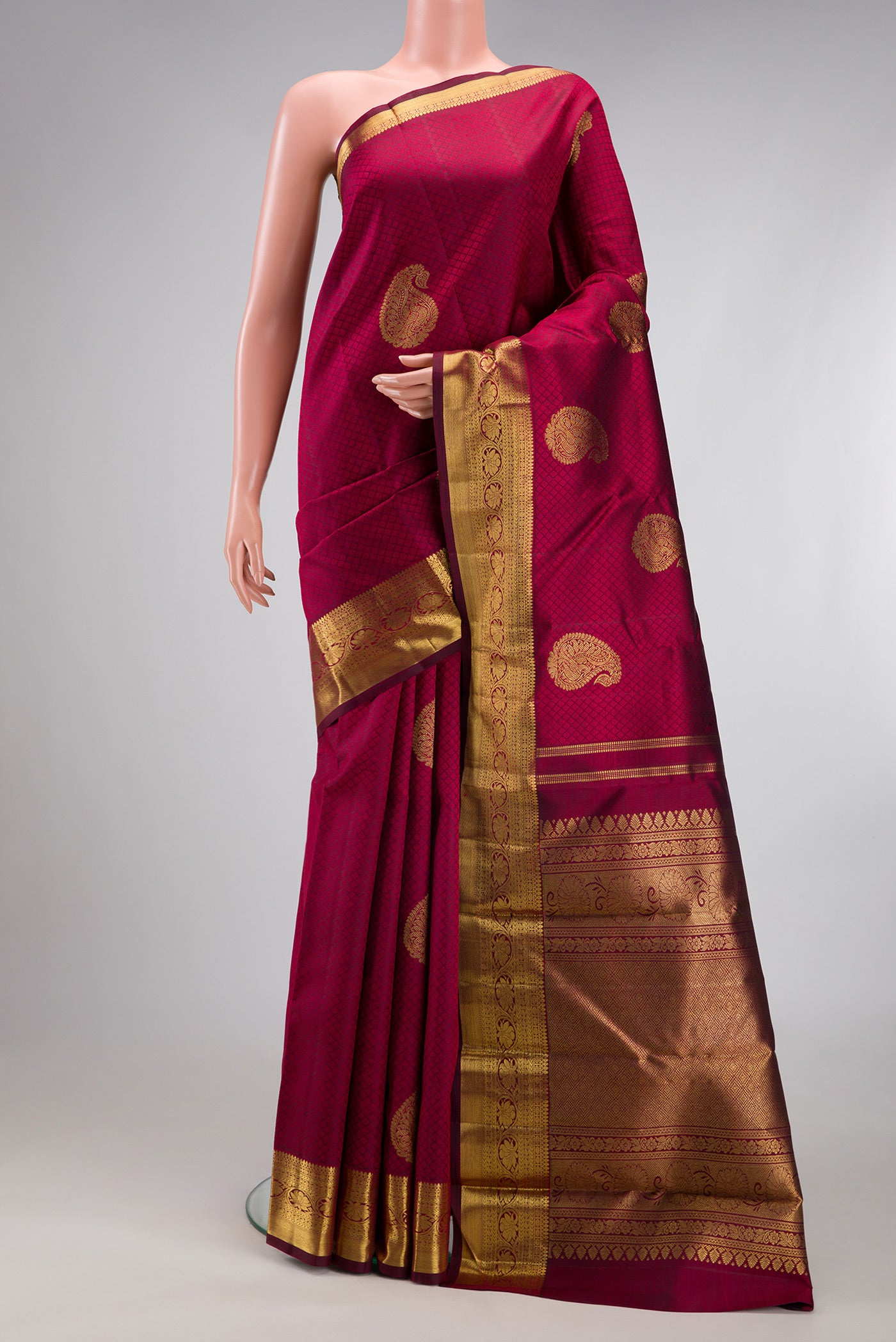 Pure Silk Pure Zari Maroon Kanjivaram Saree with Jacquard With Zari Butta on the body and Zari Border.  displayed on a mannequin