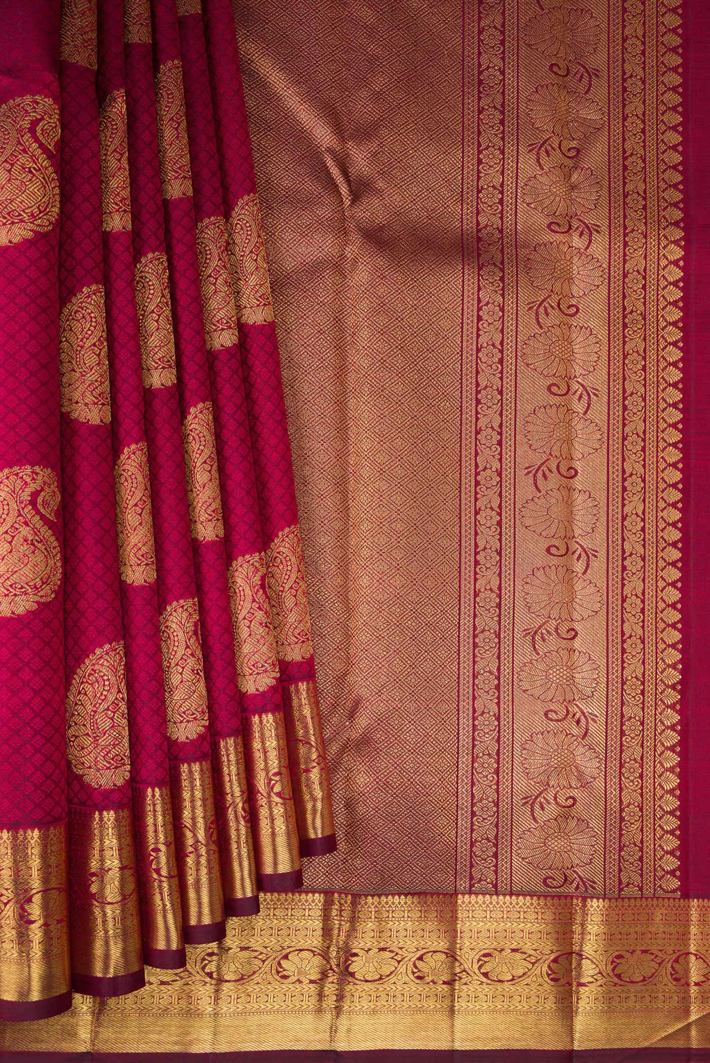 Pleats and pallu of Pure Silk Pure Zari Maroon Kanjivaram Saree with Jacquard With Zari Butta on the body and Zari Border. 