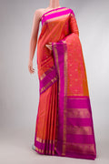 Pure Silk Pure Zari Coral Dual Tone Kanjivaram Saree with Zari Butta on the body and Zari Border.  displayed on a mannequin