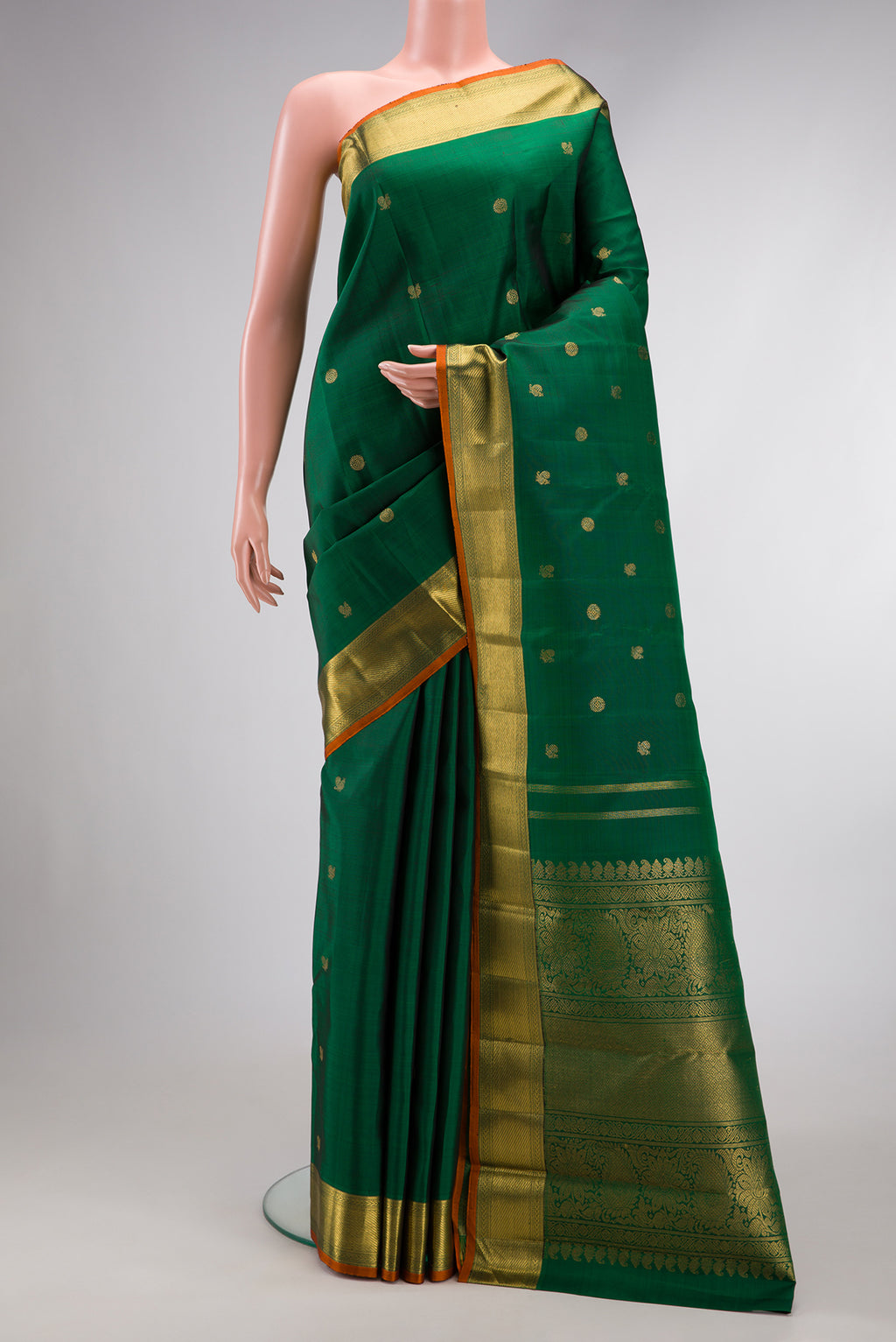 Pure Silk Pure Zari Green Dual Tone Kanjivaram Saree with Zari Butta on the body and Zari Border.  displayed on a mannequin