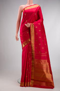 Red Dual Tone Kanjivaram Silk Saree with Zari Butta on the body and Zari Border.  displayed on a mannequin