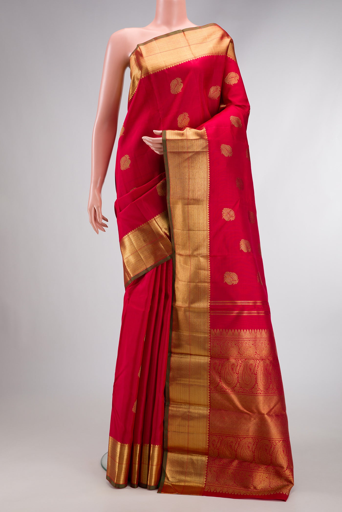 Pure Silk Pure Zari Red Dual Tone Kanjivaram Saree with Zari Butta on the body and Zari Border.  displayed on a mannequin