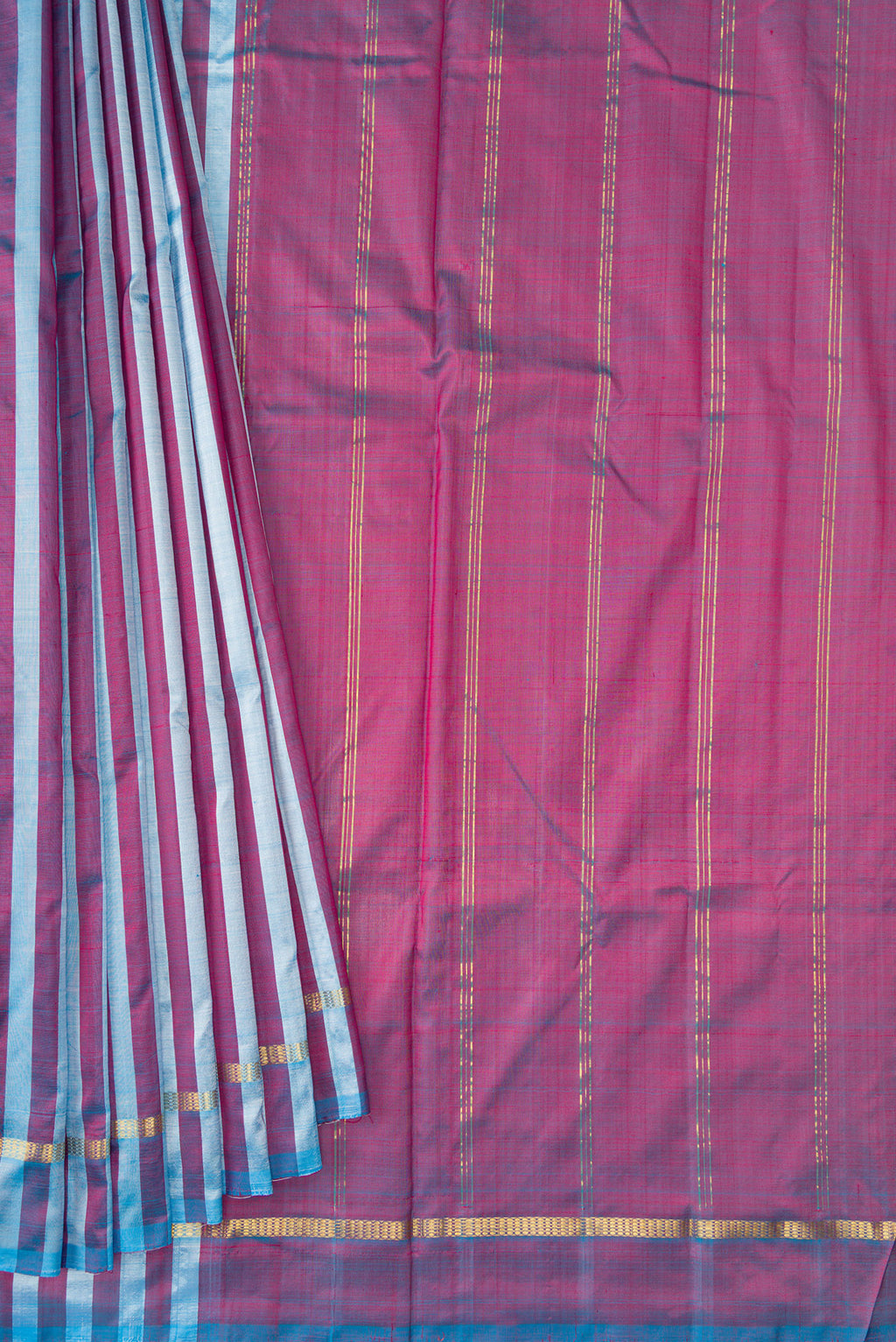 Pleats and pallu of Blue and Maroon Color Kanchipuram Silk Saree with Stripes on the body and Zari Border. 