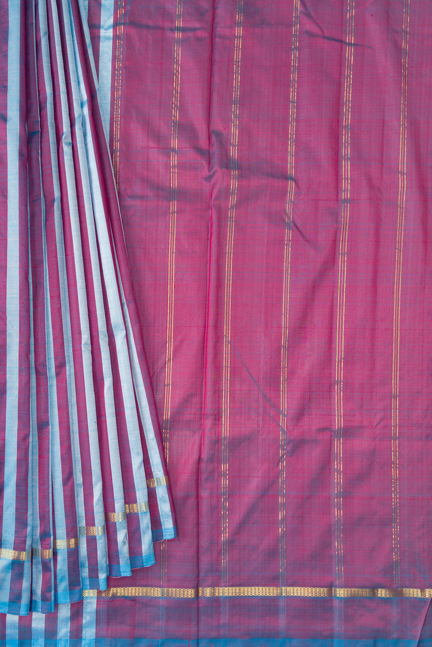 Pleats and pallu of Blue and Maroon Color Kanchipuram Silk Saree with Stripes on the body and Zari Border. 