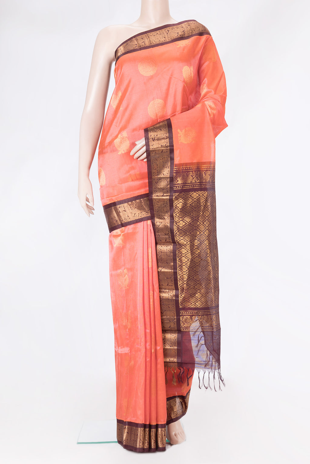 Peach Dual Tone Silk Cotton Saree with Zari Butta on the body and Zari Border.  displayed on a mannequin