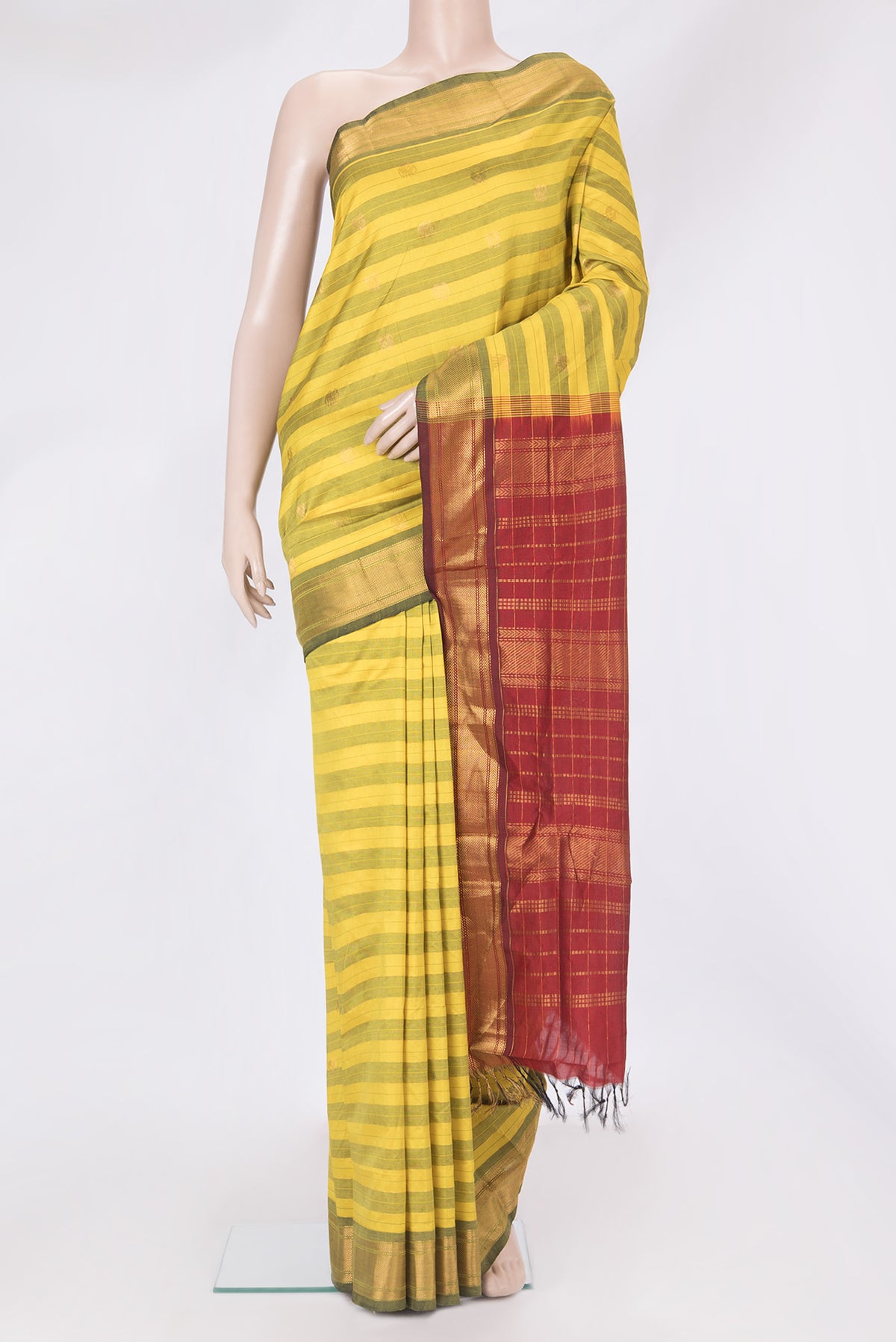 Yellow Silk Cotton Saree with Stripes on the body and Zari Border.  displayed on a mannequin