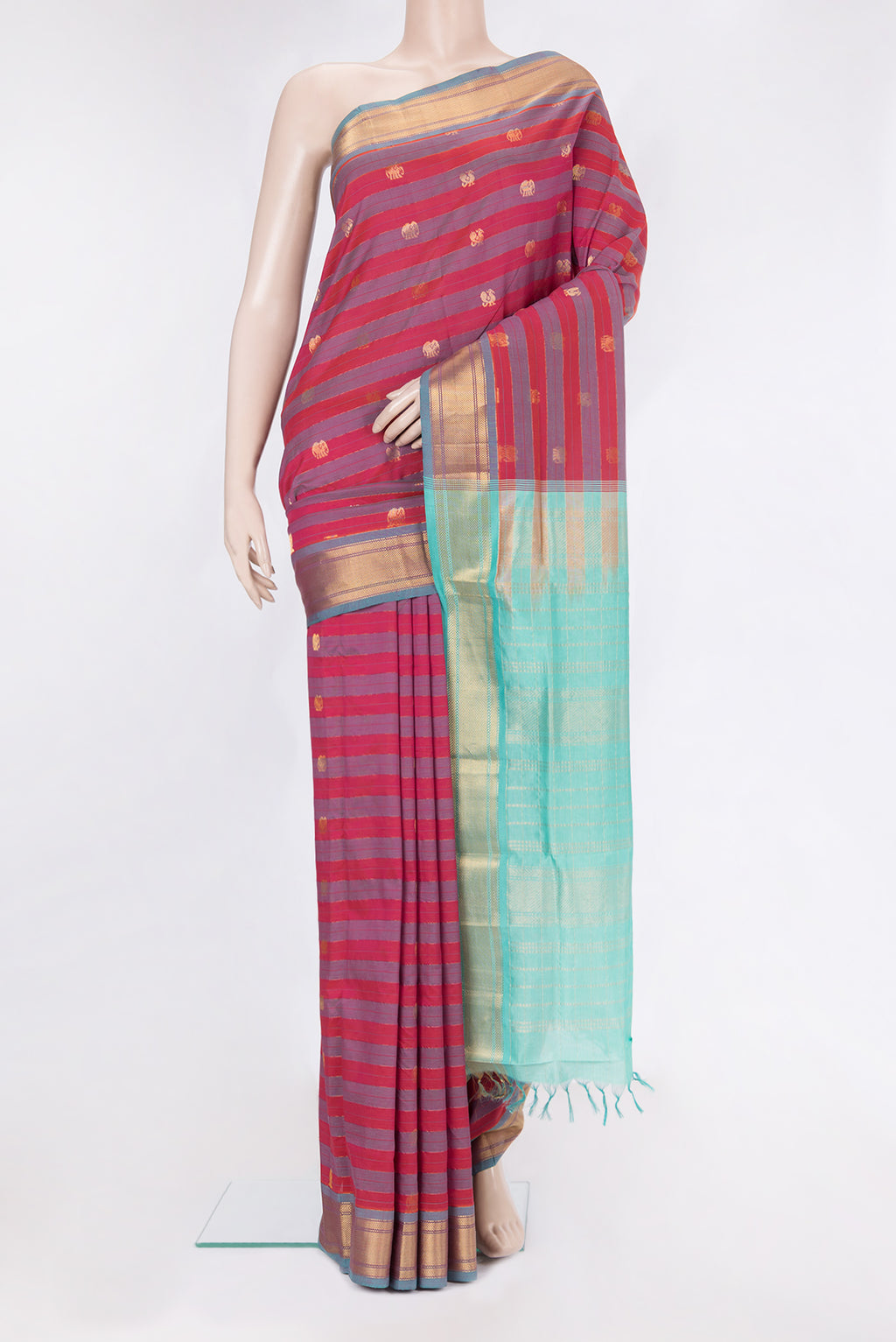 Multi Color Silk Cotton Saree with Stripes on the body and Zari Border.  displayed on a mannequin
