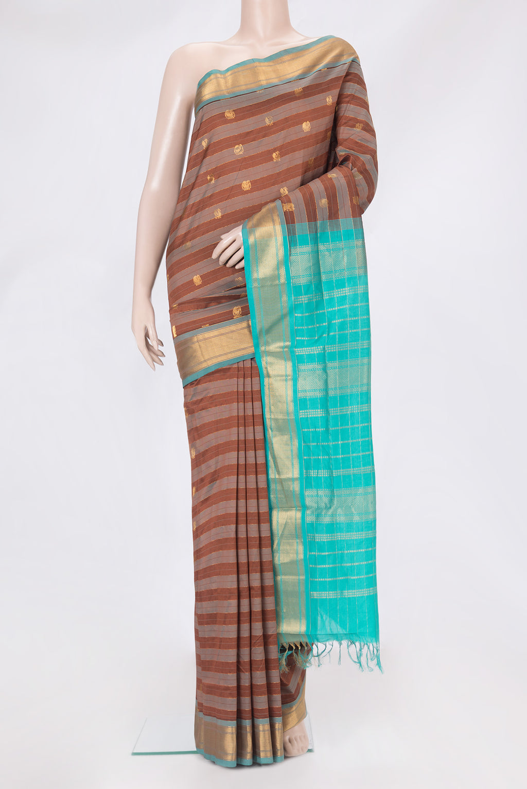 Brown Silk Cotton Saree with Stripes on the body and Zari Border.  displayed on a mannequin