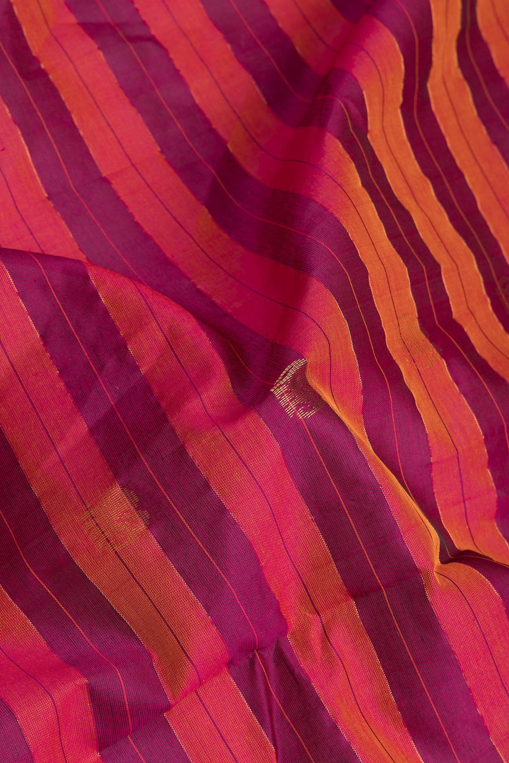 Close up of Multi Color Silk Cotton Saree with Stripes on the body and Zari Border.  displaying folds