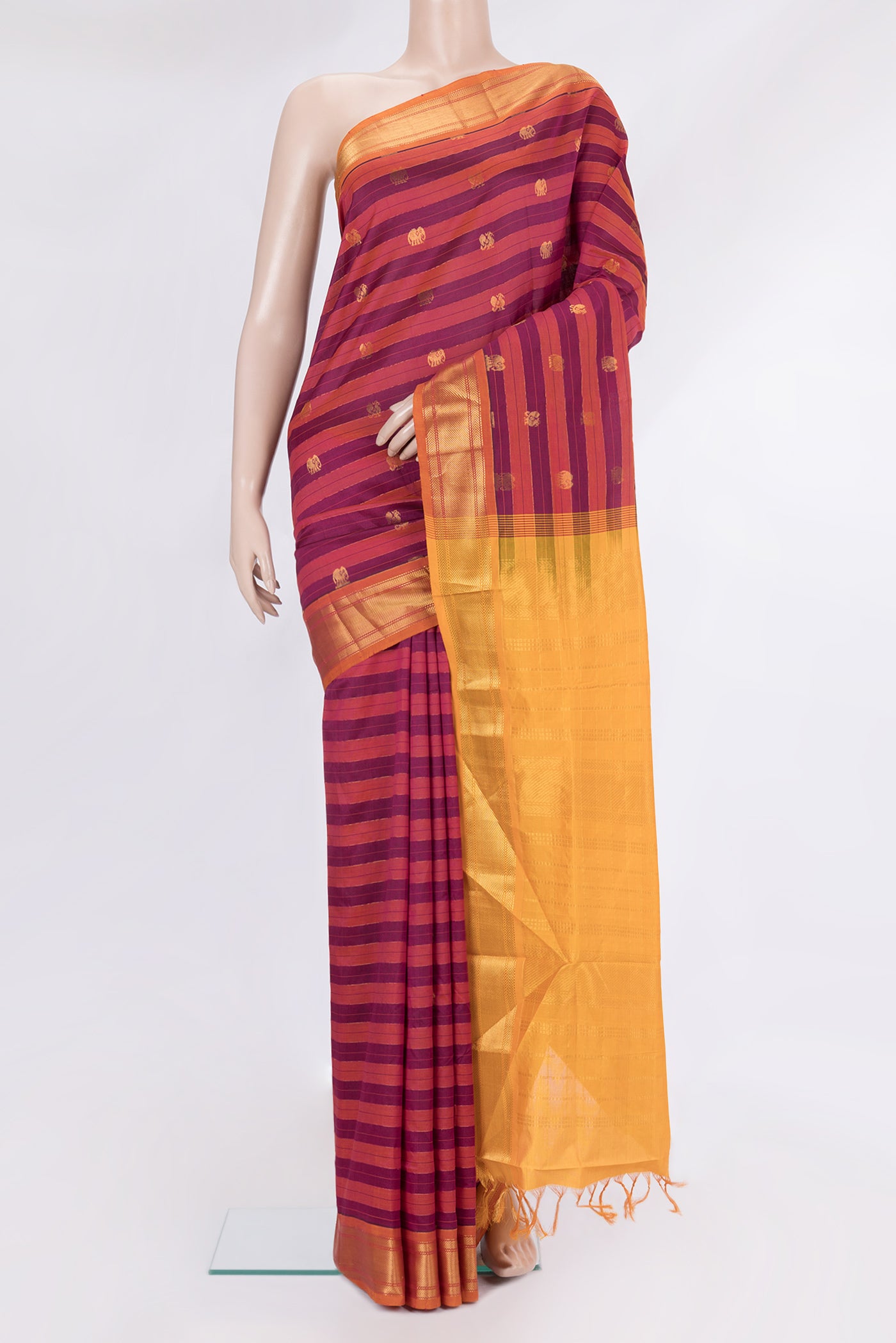 Multi Color Silk Cotton Saree with Stripes on the body and Zari Border.  displayed on a mannequin