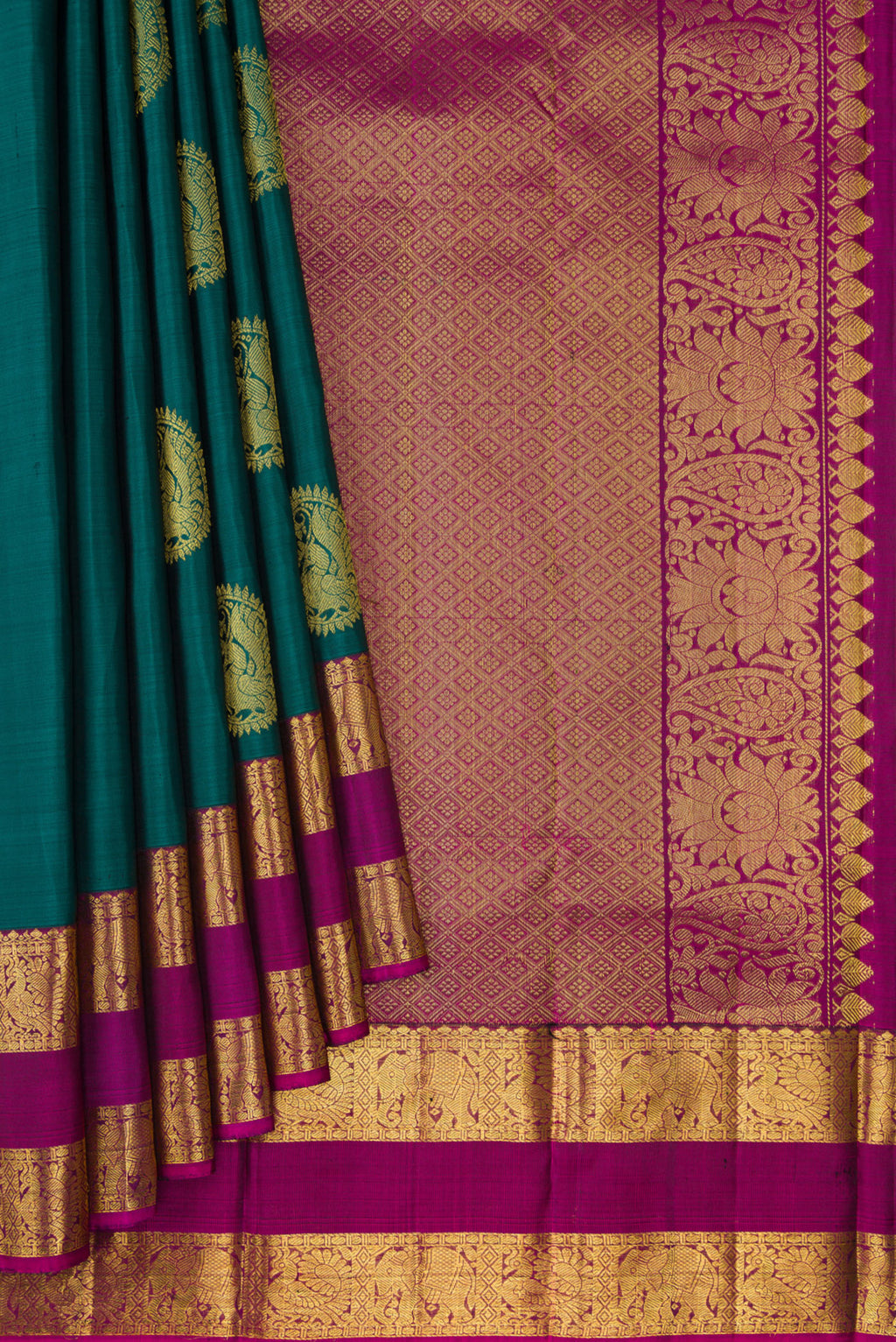 Pleats and pallu of Green Dual Tone Kanjivaram Silk Saree with Zari Butta on the body and Zari Border. 