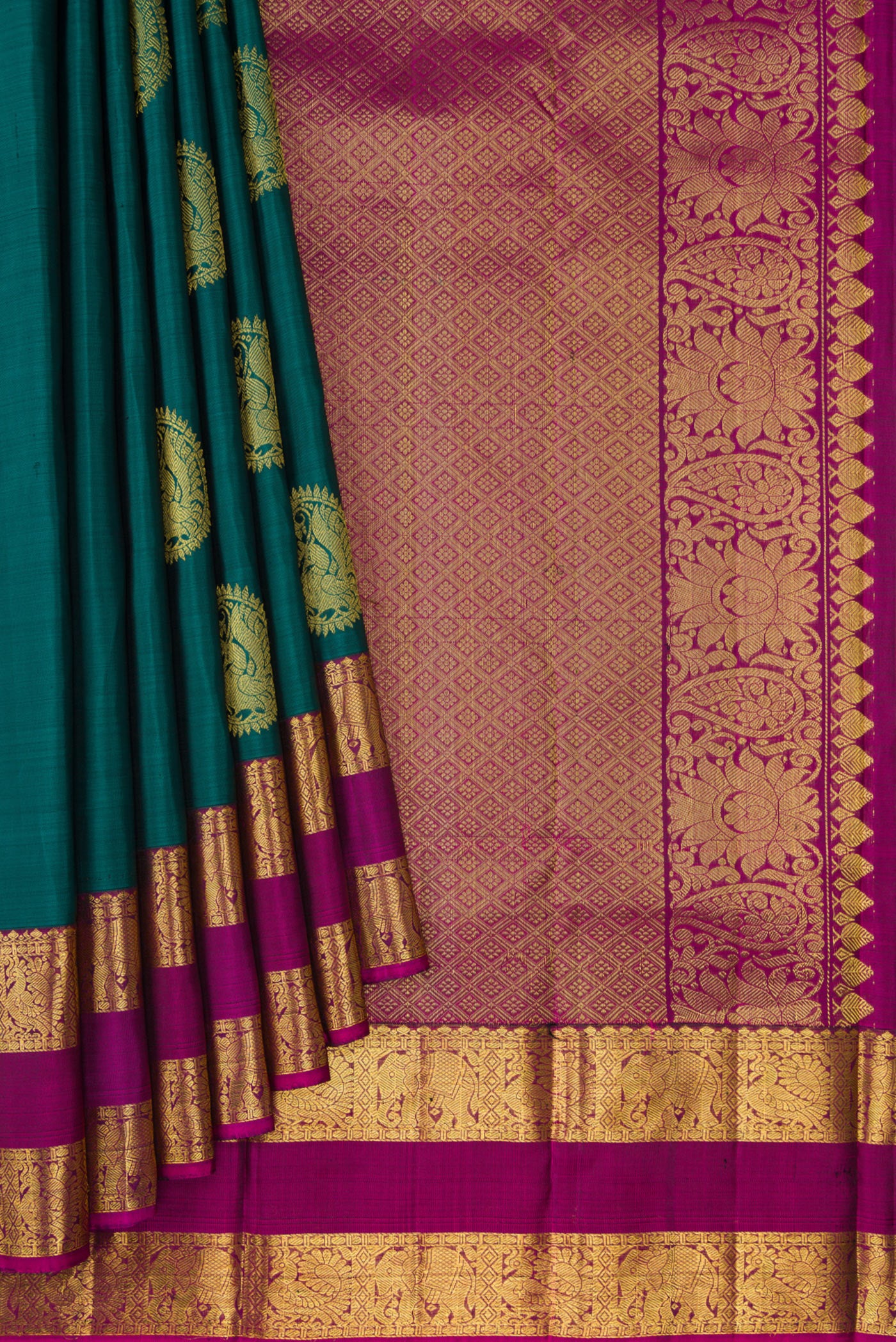 Pleats and pallu of Green Dual Tone Kanjivaram Silk Saree with Zari Butta on the body and Zari Border. 