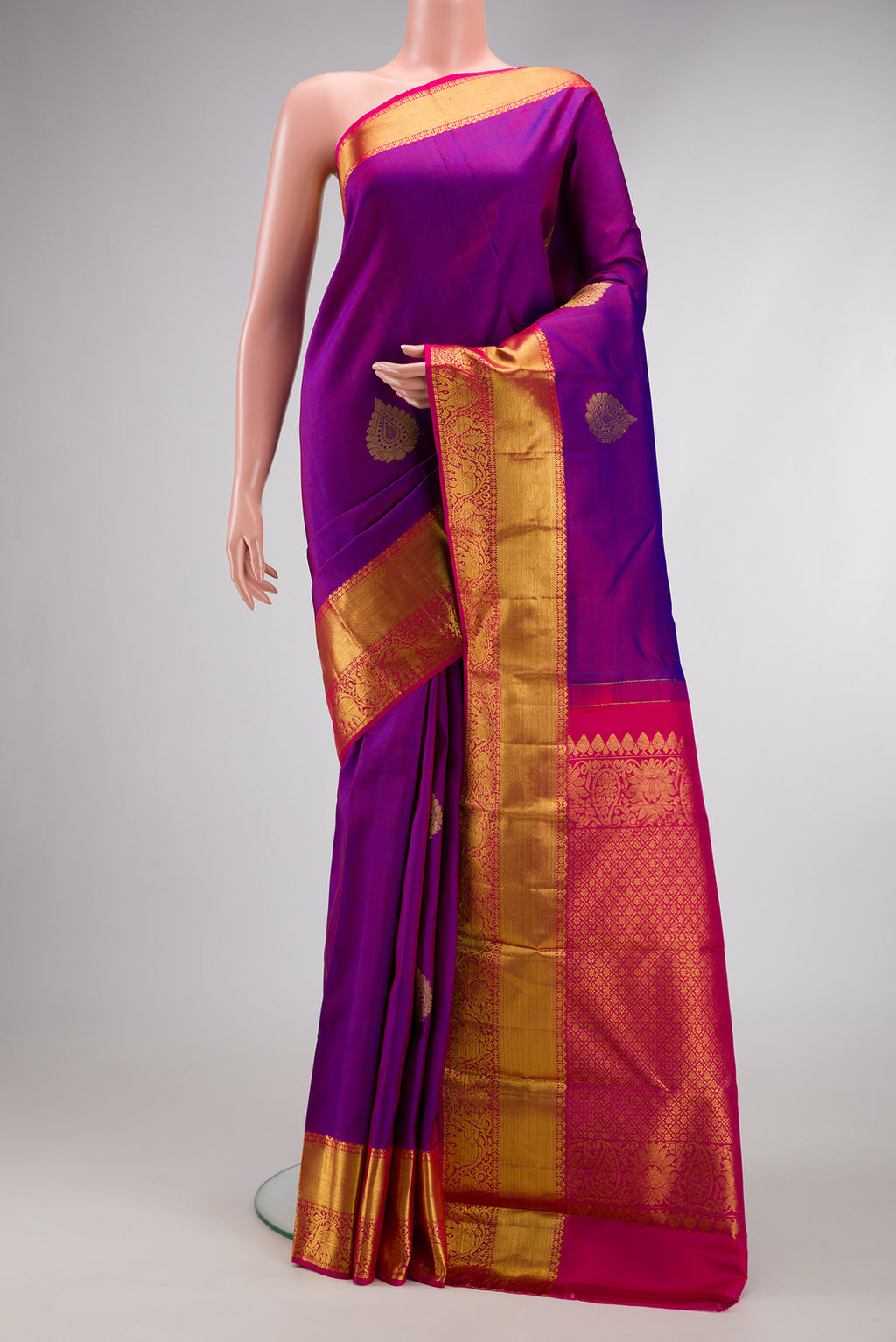 Purple Dual Tone Kanjivaram Silk Saree with Zari Butta on the body and Zari Border.  displayed on a mannequin