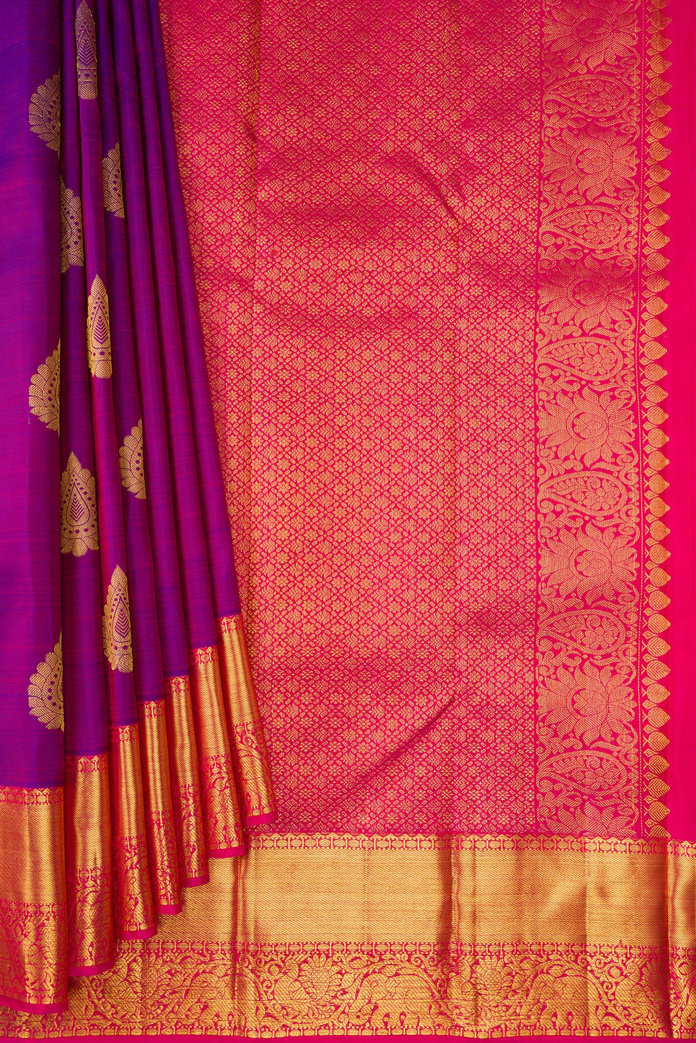 Pleats and pallu of Purple Dual Tone Kanjivaram Silk Saree with Zari Butta on the body and Zari Border. 