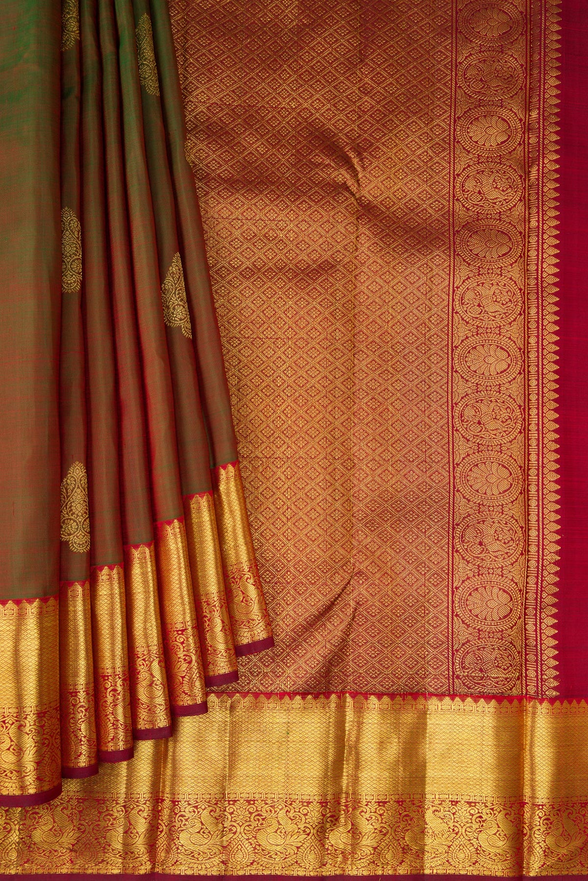 Pleats and pallu of Mehandi Green Dual Tone Kanjivaram Silk Saree with Zari Butta on the body and Zari Border. 