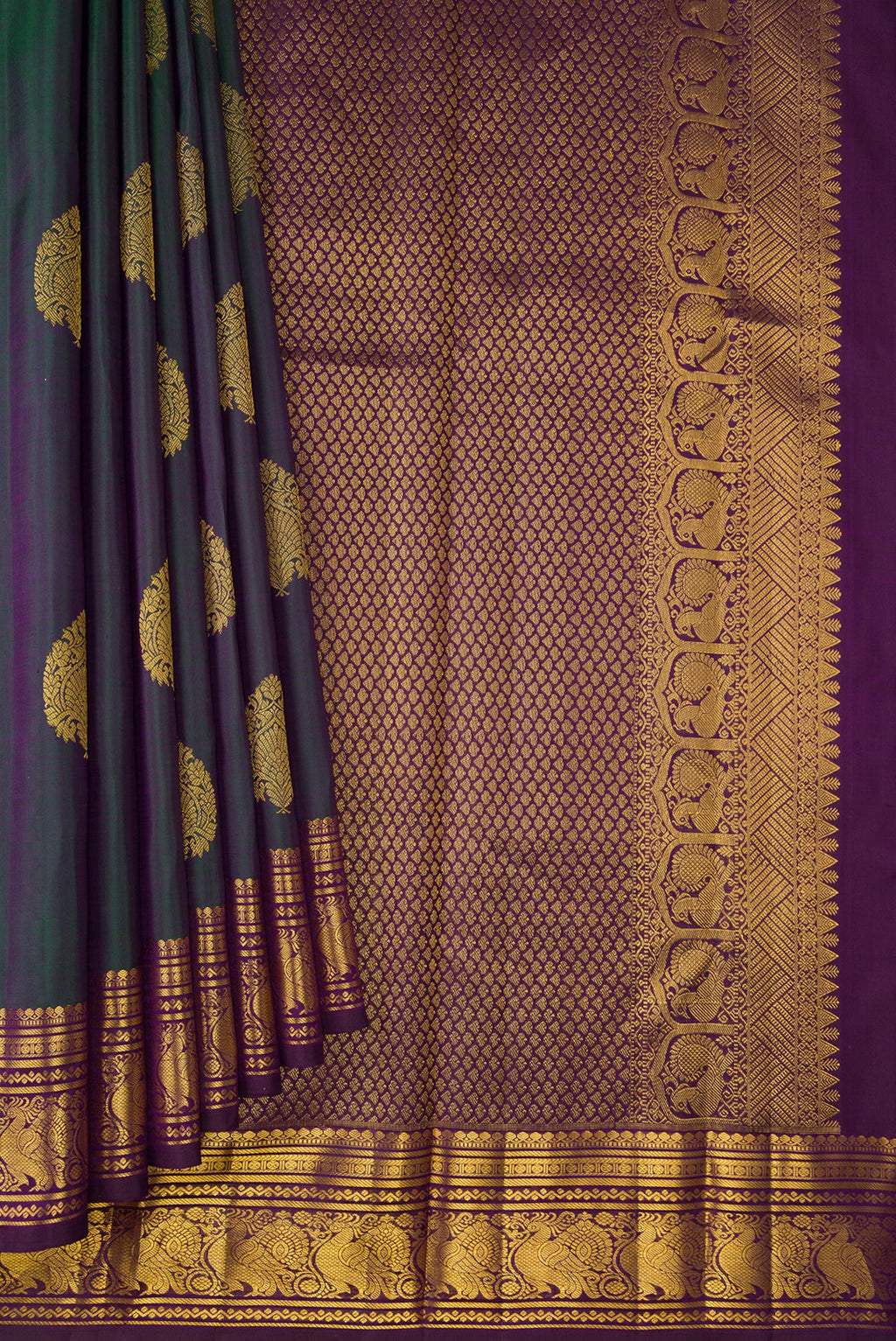 Pleats and pallu of Bottle Green Dual Tone Kanjivaram Silk Saree with Zari Butta on the body and Zari Border. 