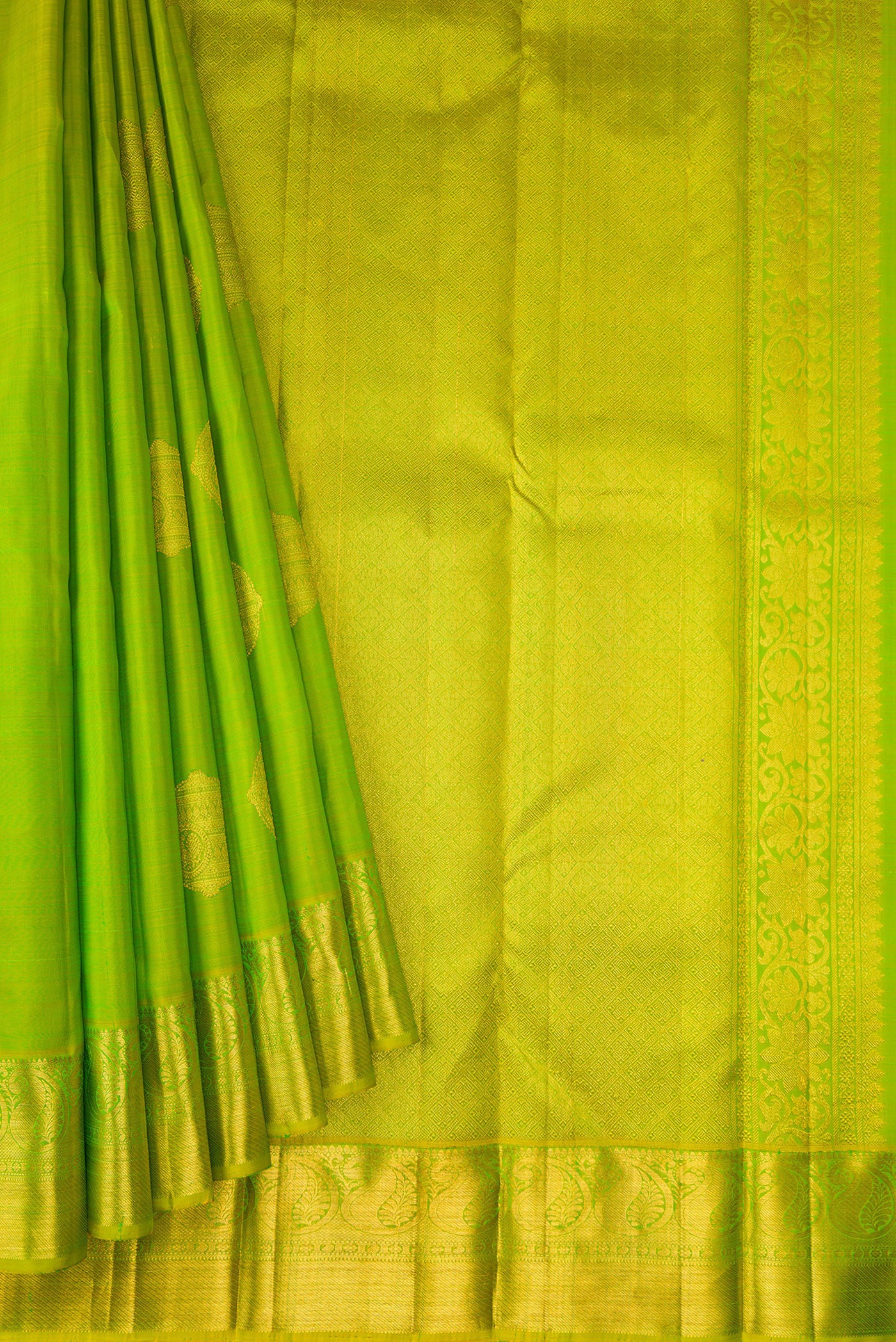 Pleats and pallu of Parrot Green Dual Tone Kanjivaram Silk Saree with Zari Butta on the body and Zari Border. 