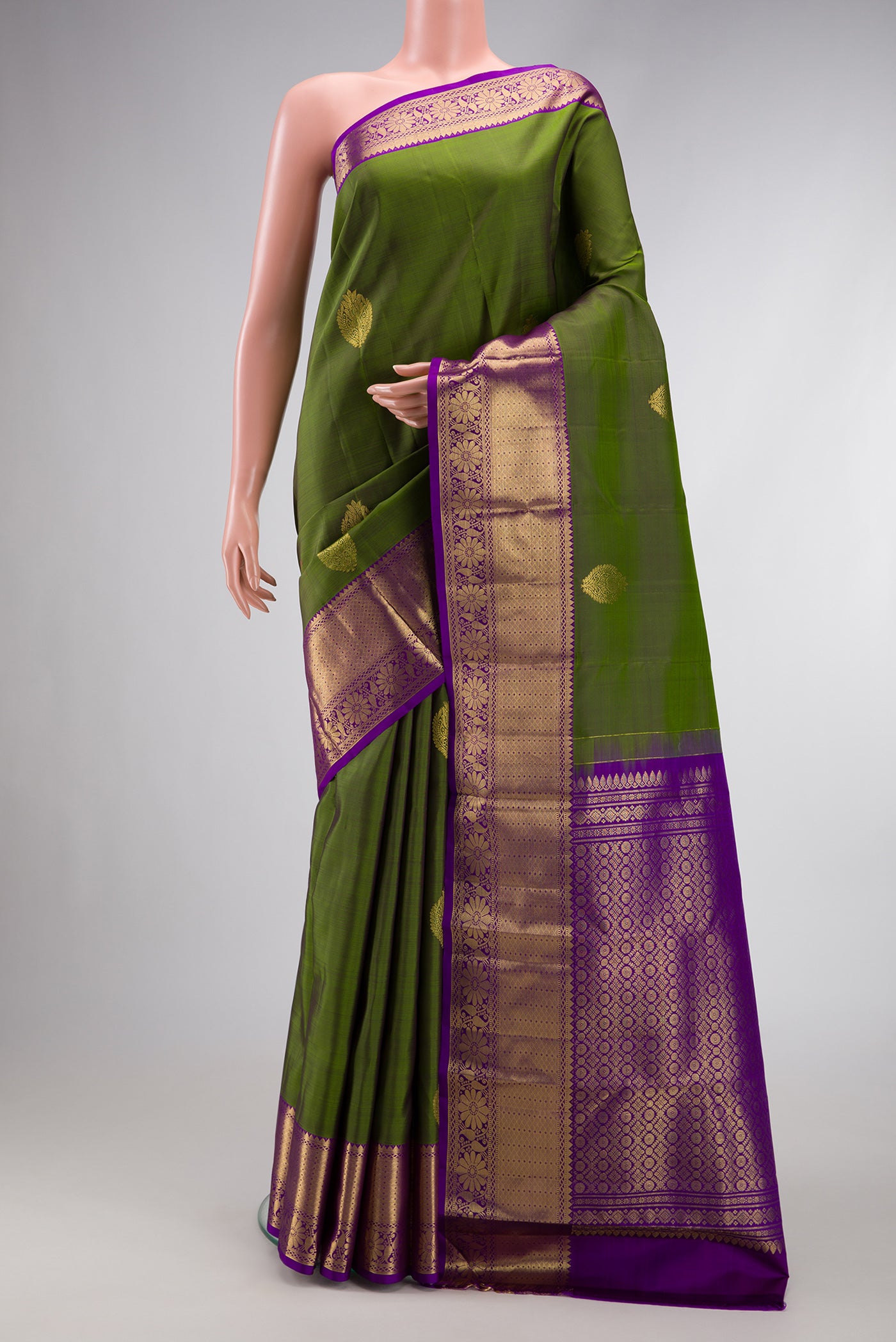 Magenta Dual Tone Kanjivaram Silk Saree with Zari Butta on the body and Zari Border.  displayed on a mannequin