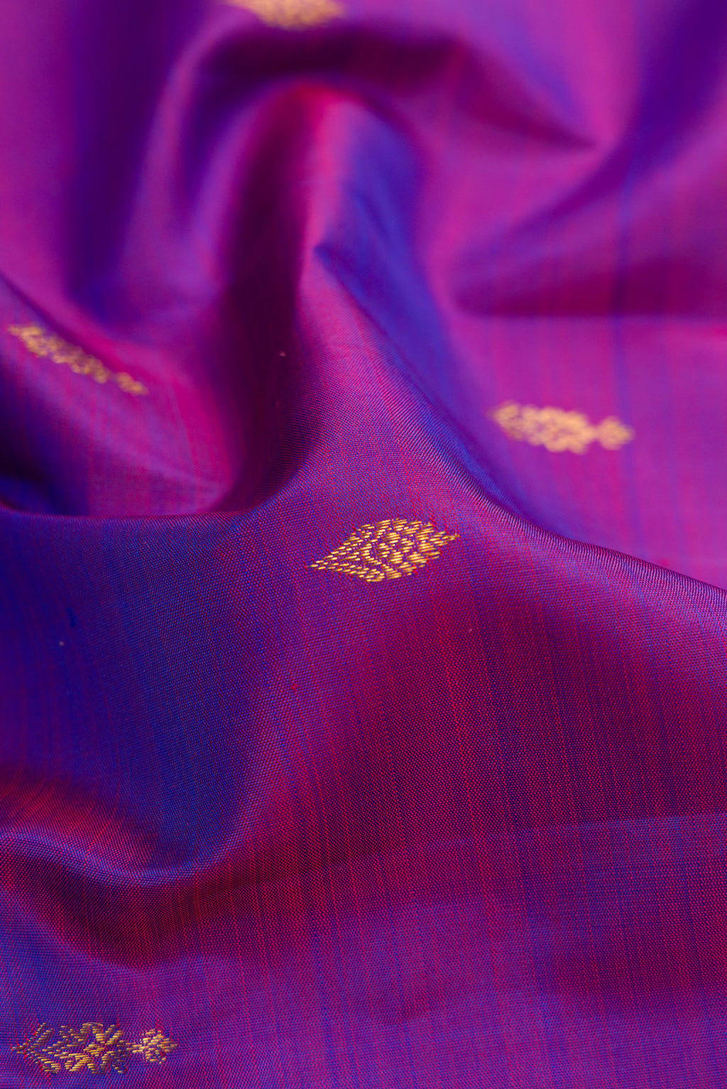 Close up of Purple Dual Tone Kanjivaram Silk Saree with Zari Butta on the body and Zari Border.  displaying folds